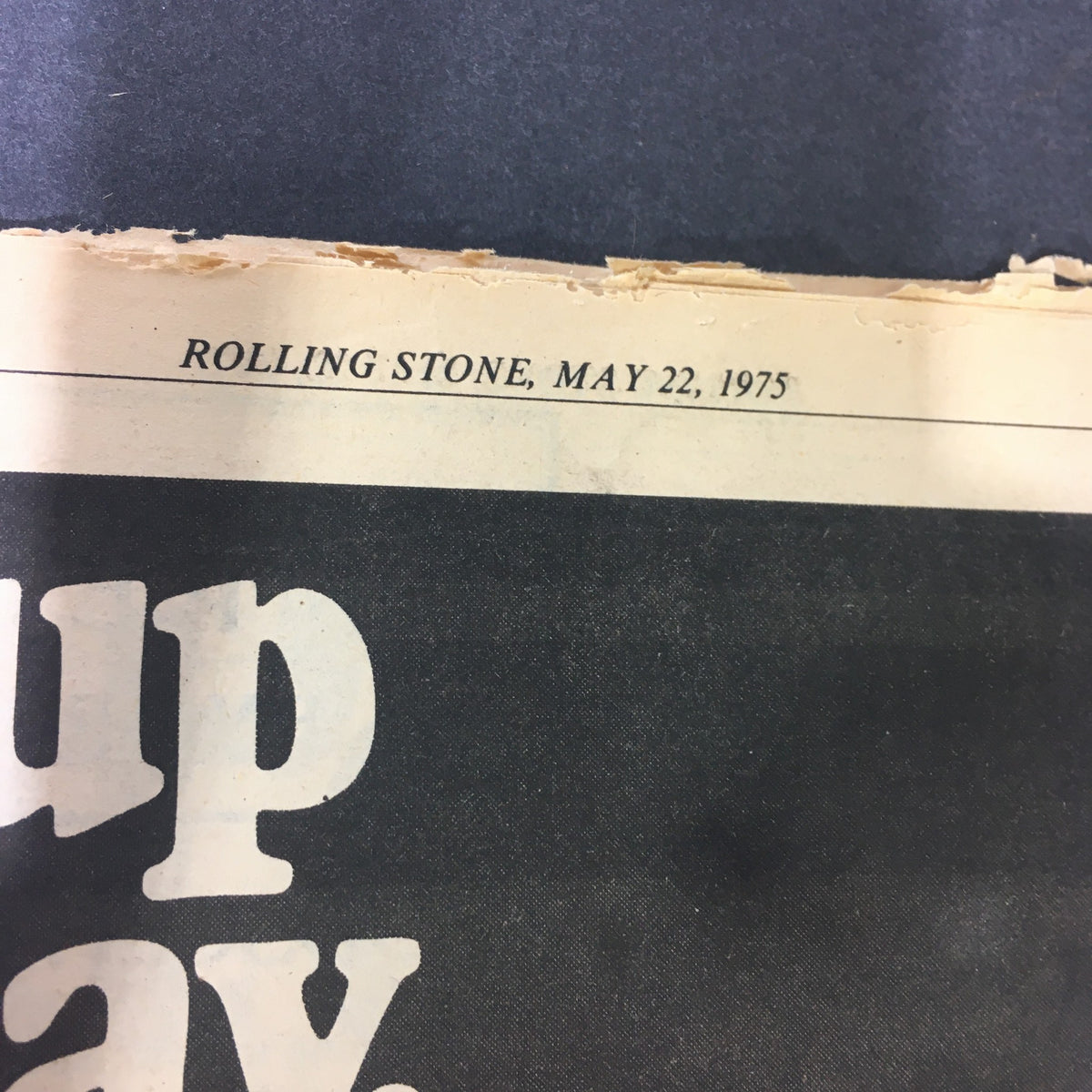 Top view of the cover of vintage Rolling Stone Magazine dated May 22, 1975, featuring notable title and date details, showcasing its historical significance.