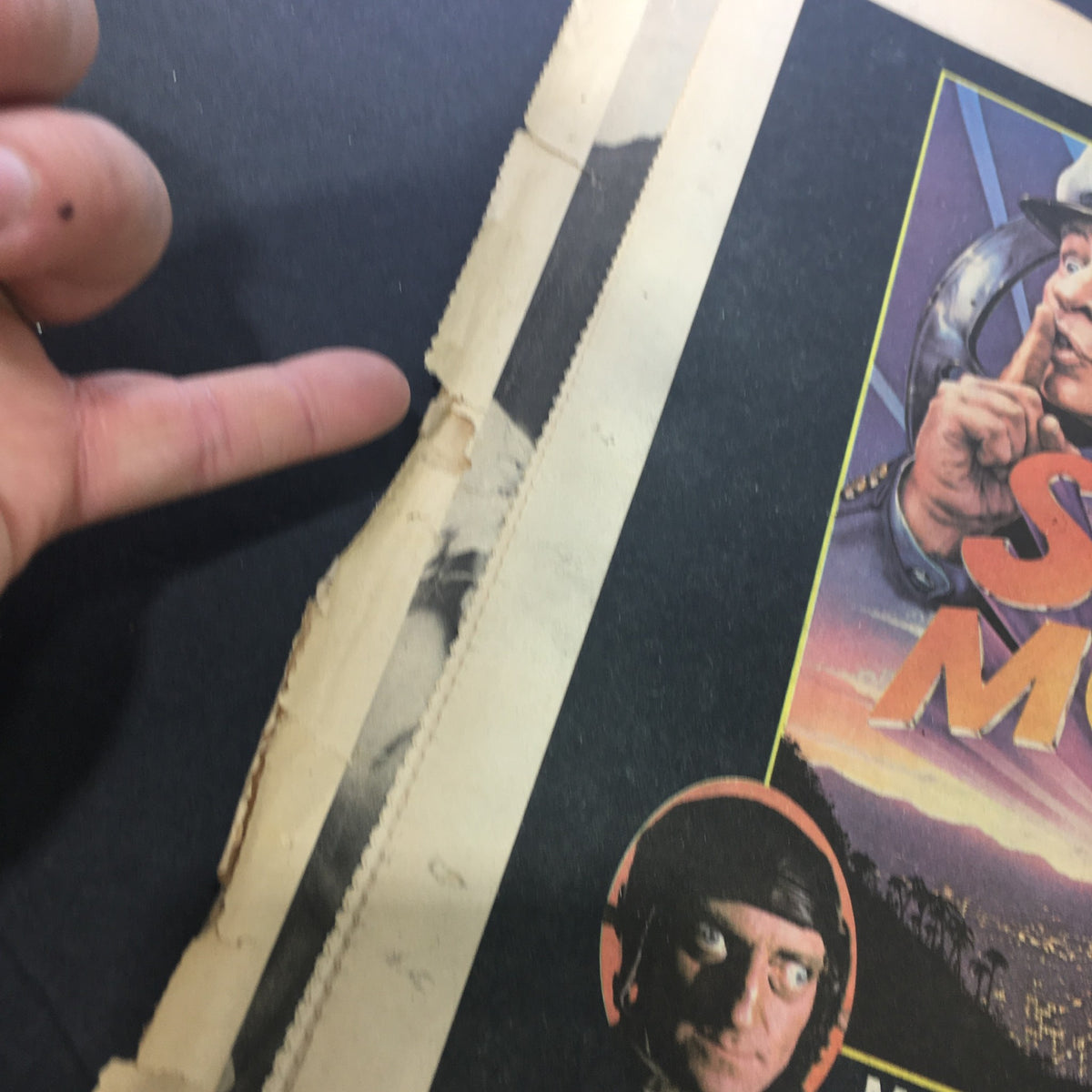 Close-up view of the cover of VTG Rolling Stone Magazine July 1, 1975 highlighting the graphic of the film Silent Movie with visible damage.