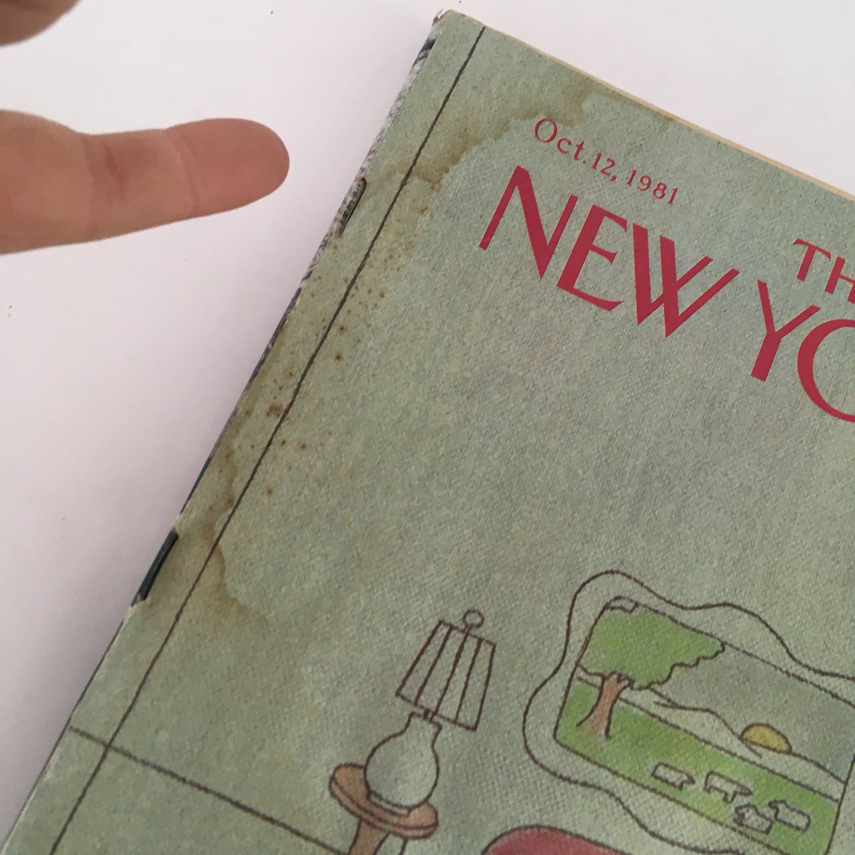 Close-up view of The New Yorker Full Magazine October 12 1981 cover highlighting details like water damage and signs of wear, maintaining its vintage charm.