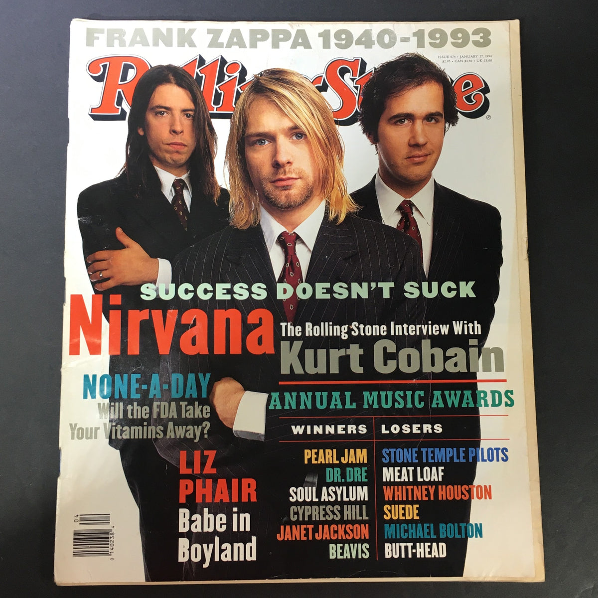 Cover of VTG Rolling Stone Magazine January 27, 1994 featuring Kurt Cobain with Nirvana, and Liz Phair. The cover highlights the theme 'Success Doesn’t Suck' along with various music awards winners.