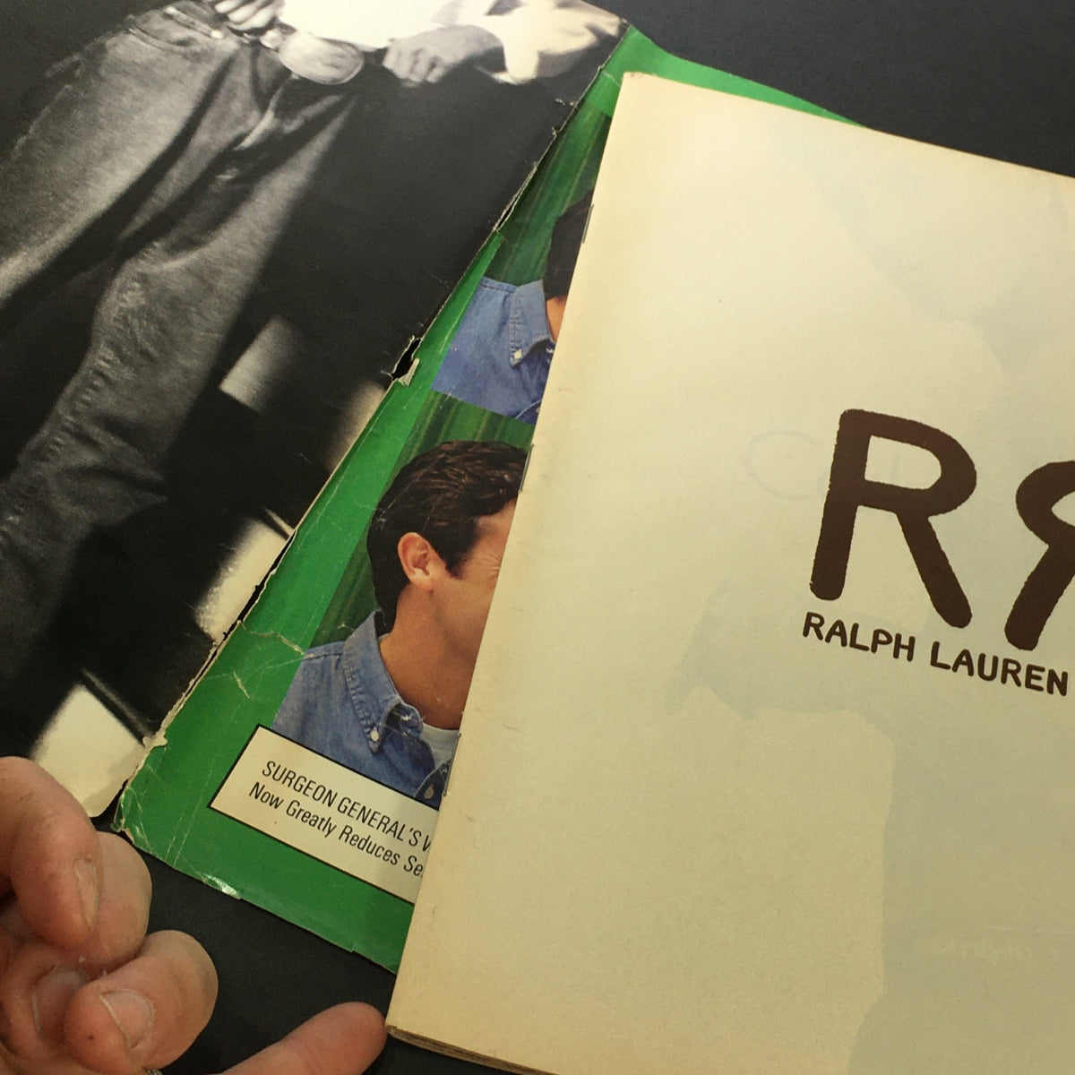 Inside view of the November 25, 1993, Rolling Stone Magazine, highlighting aged pages with minor wear and an advertisement for Ralph Lauren.