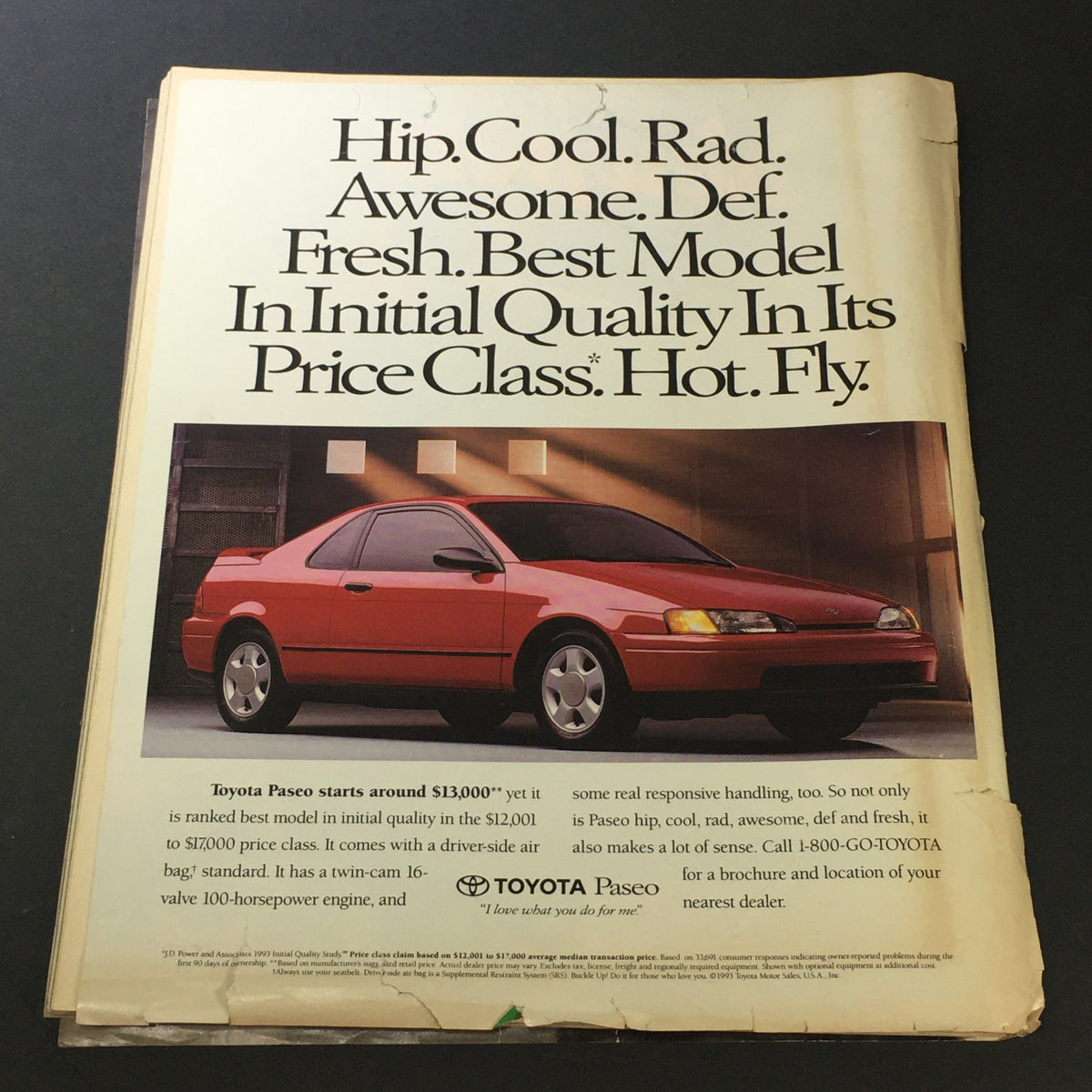 Advertisement from the Rolling Stone Magazine November 25, 1993 showcasing a Toyota Paseo with an eye-catching design and text discussing its features.