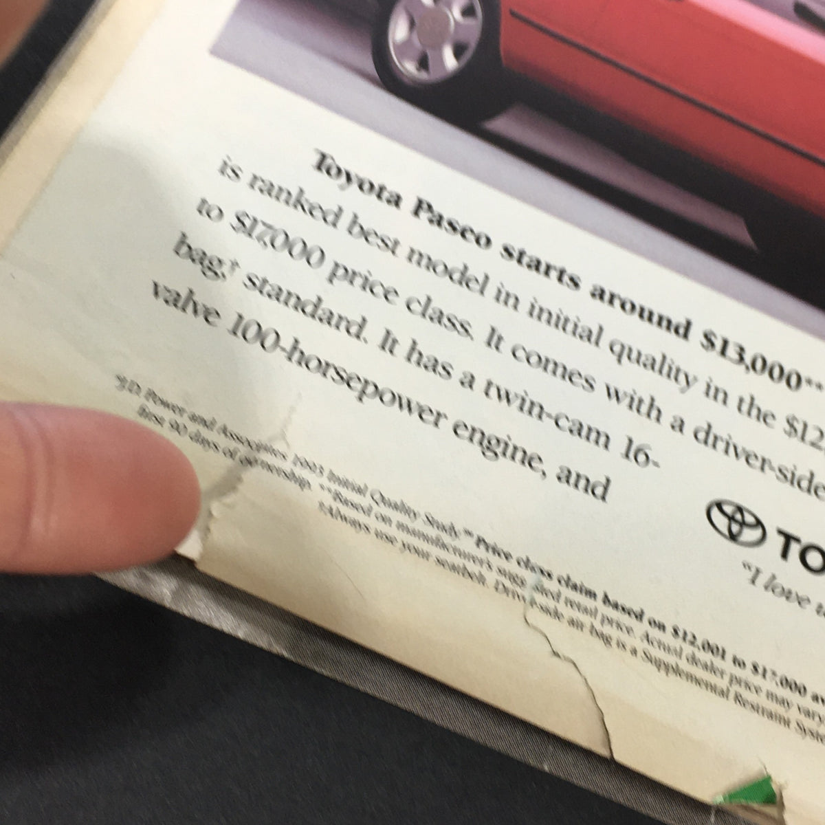 Detailed view of the Toyota Paseo advertisement from the Rolling Stone Magazine November 25, 1993, highlighting specifications and price information.