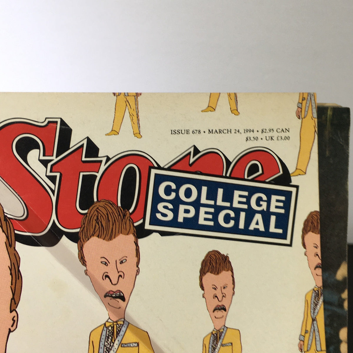 Detail of the vintage 'Rolling Stone Magazine' from March 24, 1994, showcasing the College Special label and cartoon characters Beavis and Butt-Head in iconic yellow suits.