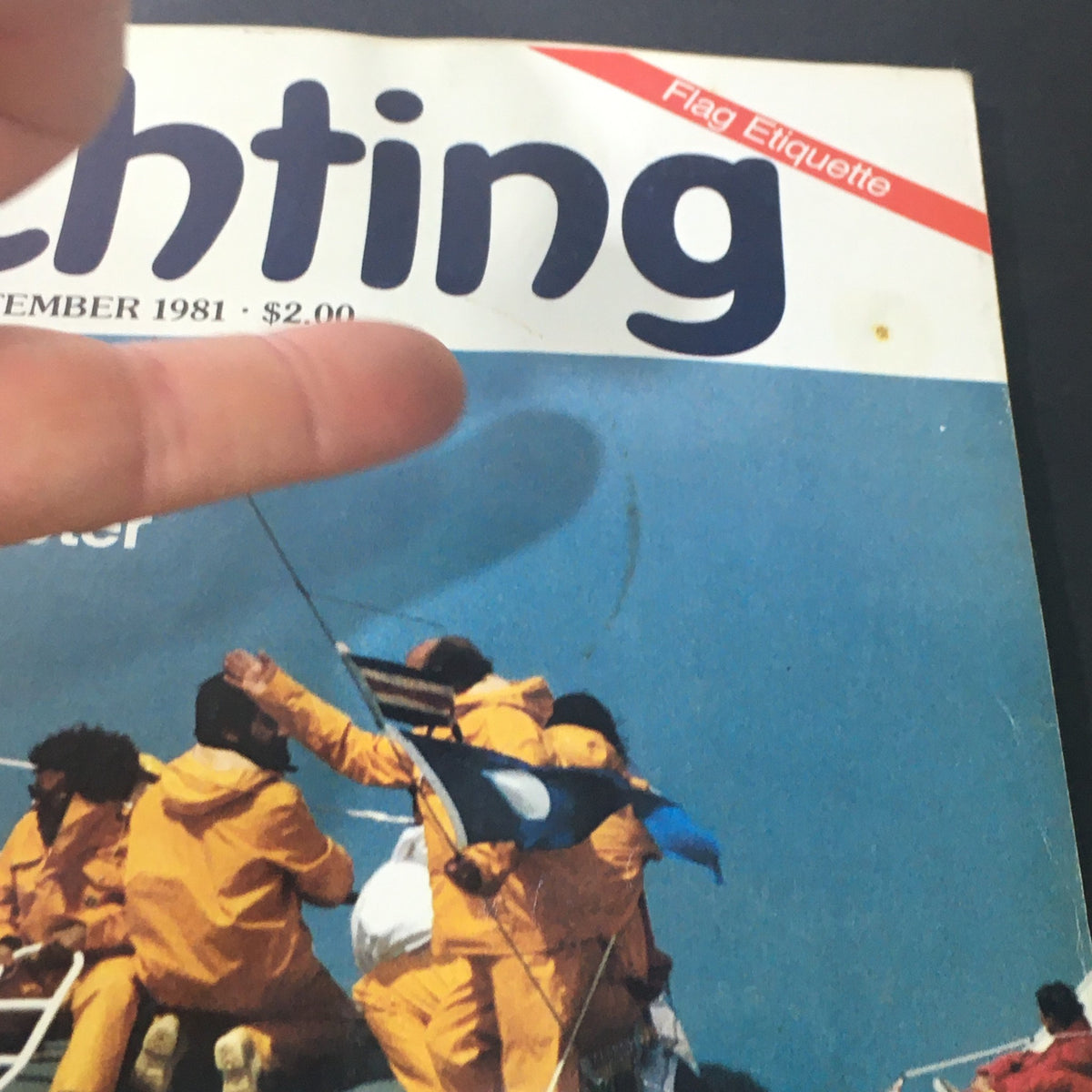 Detailed view of the VTG Yachting Magazine September 1981 cover showcasing the theme of yachting and flag etiquette, focused on the Baltimore 38.