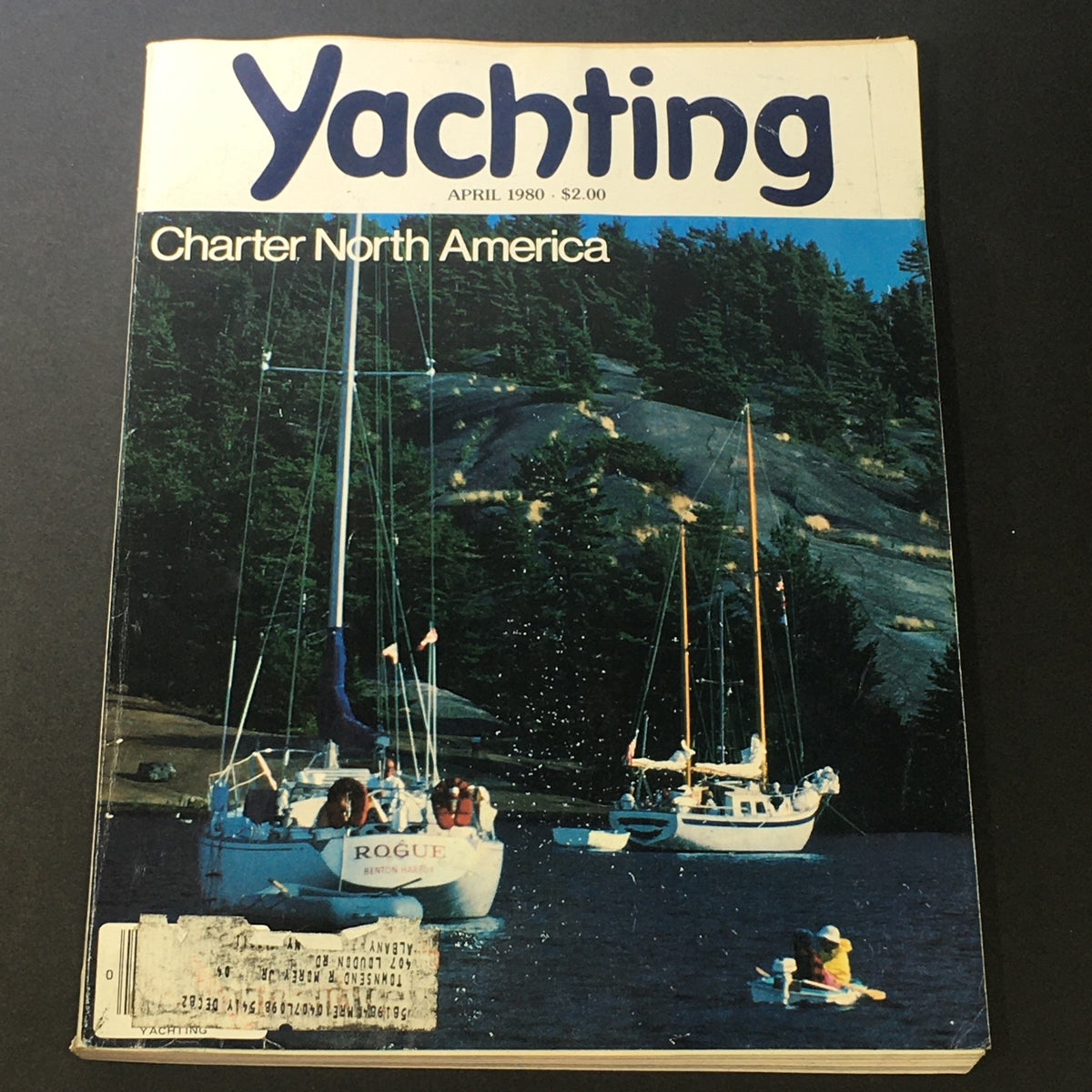 Cover of VTG Yachting Magazine April 1980 featuring articles on Charter North America and The Scow's Thing, showcasing sailboats on a tranquil water backdrop.