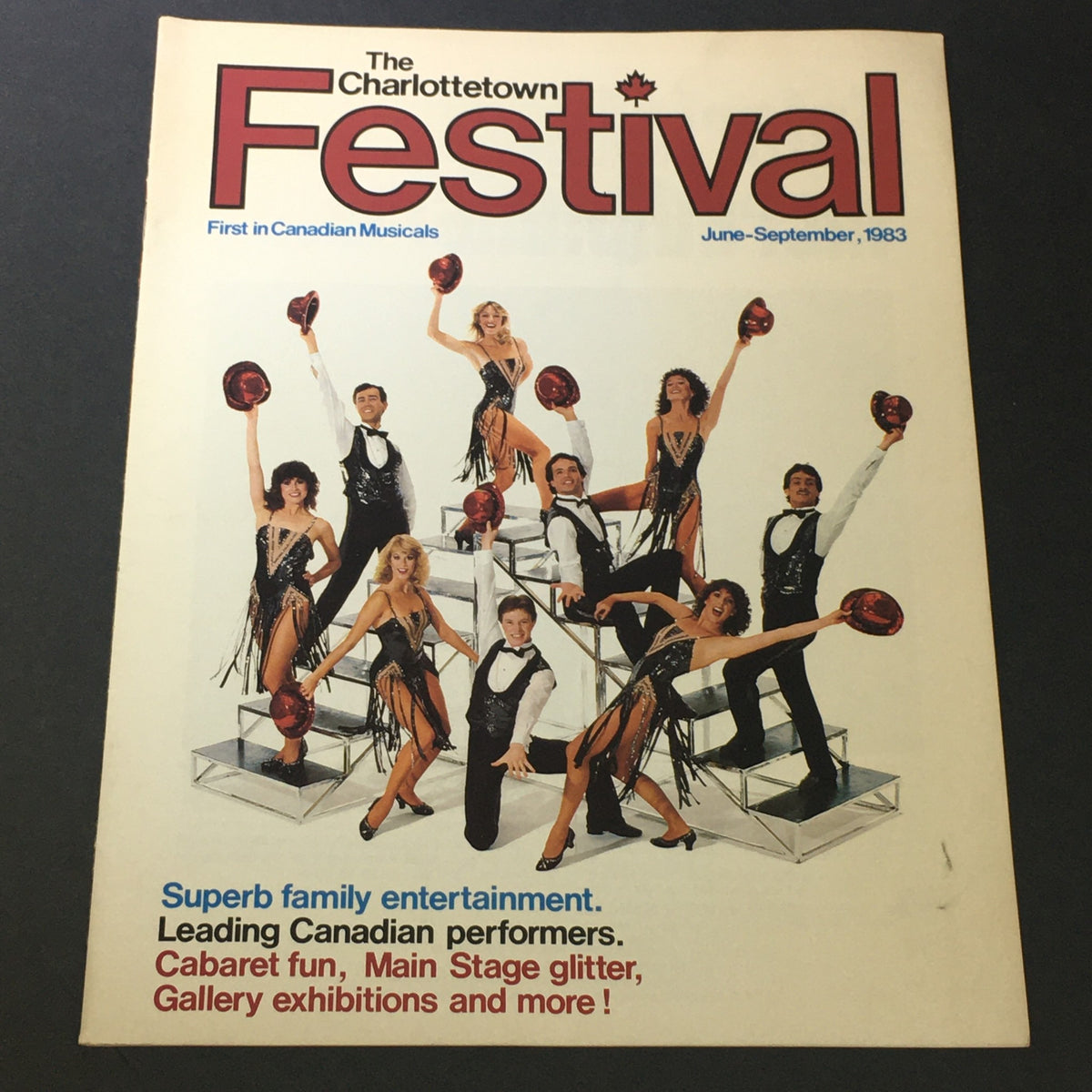 VTG The Charlottetown Festival June-September 1983 - Anne of Green Gables cover featuring a group of performers in vibrant costumes showcasing a lively and entertaining atmosphere.