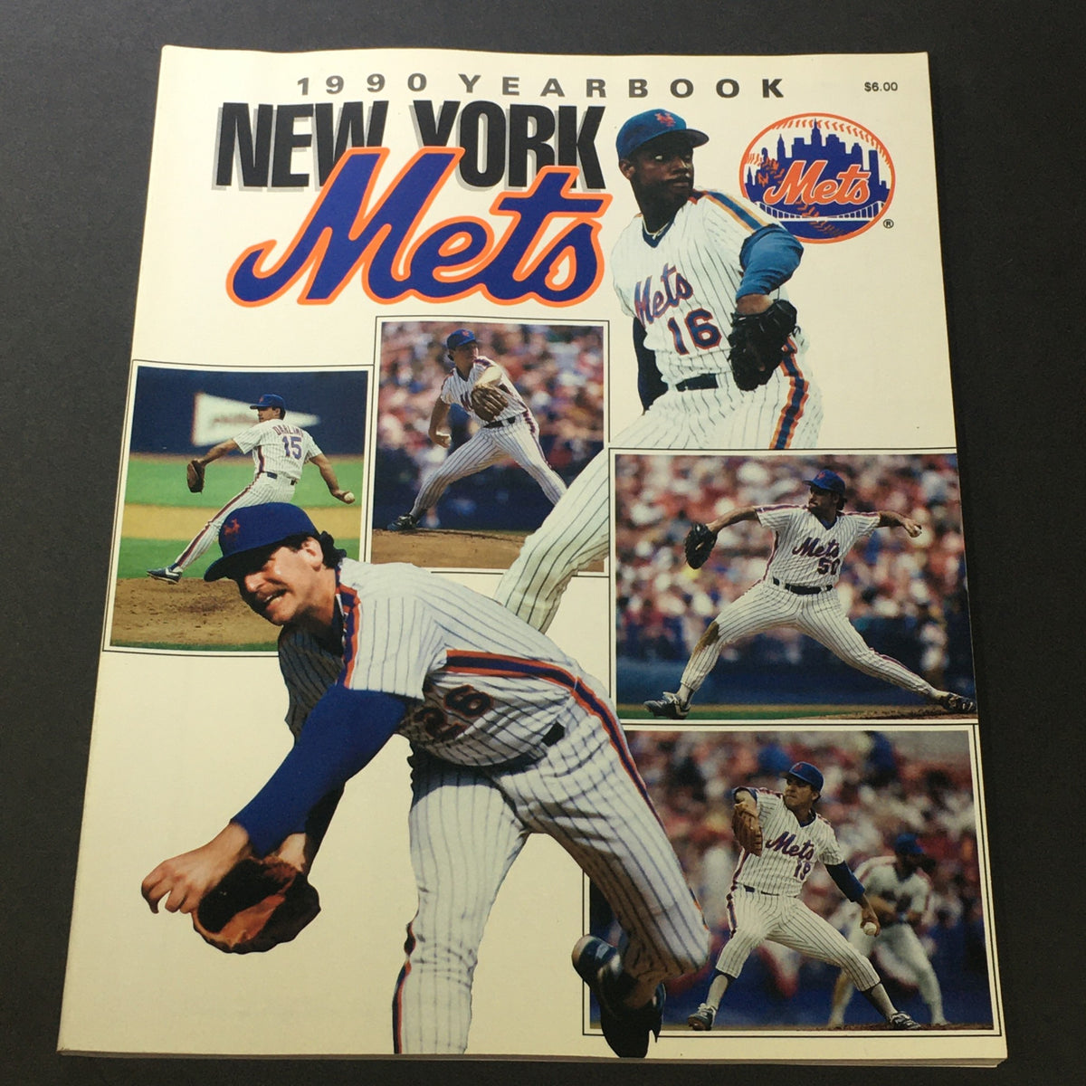 Cover of the VTG New York Mets Official Yearbook 1990 featuring images of players Dwight Gooden, Sid Fernandez, and other team members showcasing their on-field action. Perfect for collectors and baseball fans.