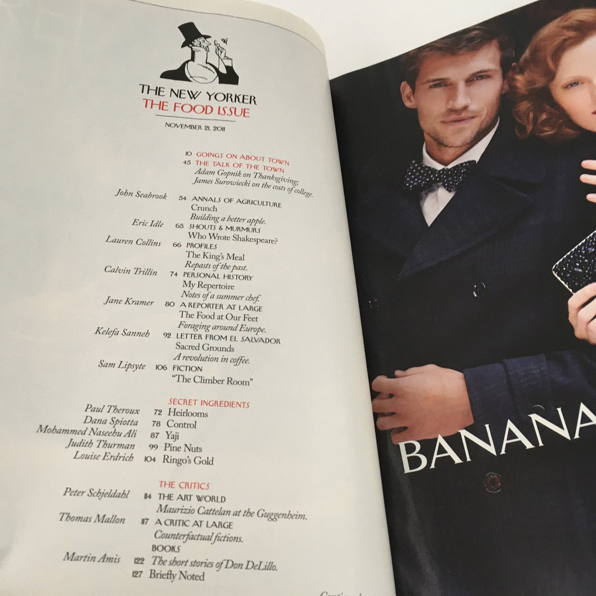 Interior page of The New Yorker Magazine from November 21, 2011, listing contents of the Food Issue. The page includes titles of articles and contributors, set against a backdrop featuring elegant figures, highlighting the magazine's focus on food and culture.