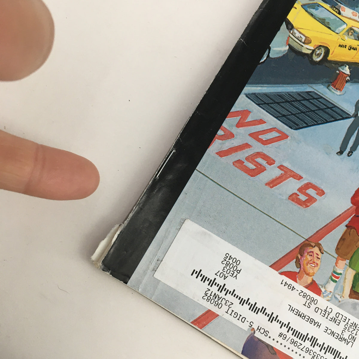 Side view of The New Yorker Magazine October 3 2011, highlighting the minor wear on the binding and address label on the cover.