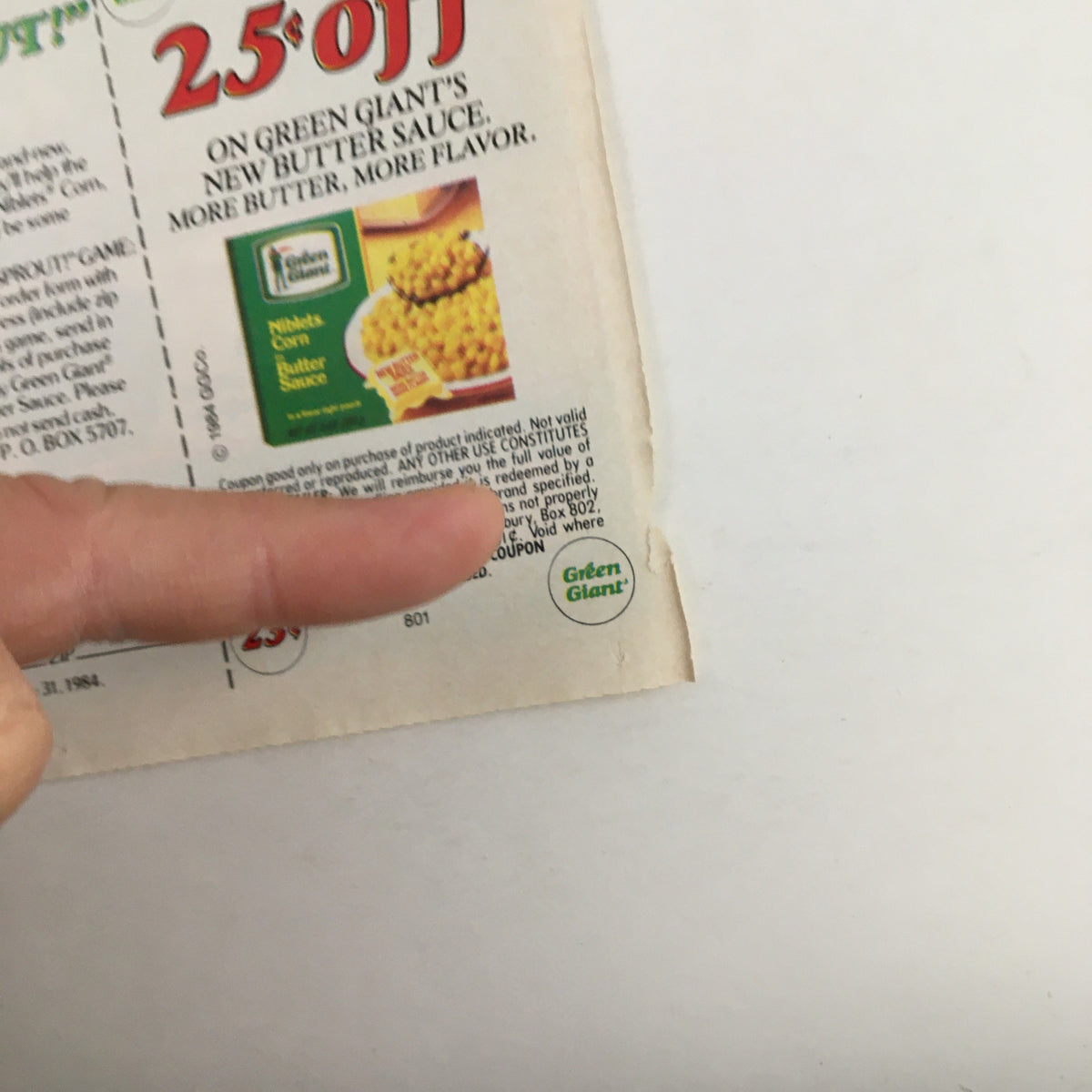 Another view of the Green Giant Niblets Corn coupon highlighting a $0.25 off promotion with the Green Giant logo, showcasing vintage advertising from 1984.