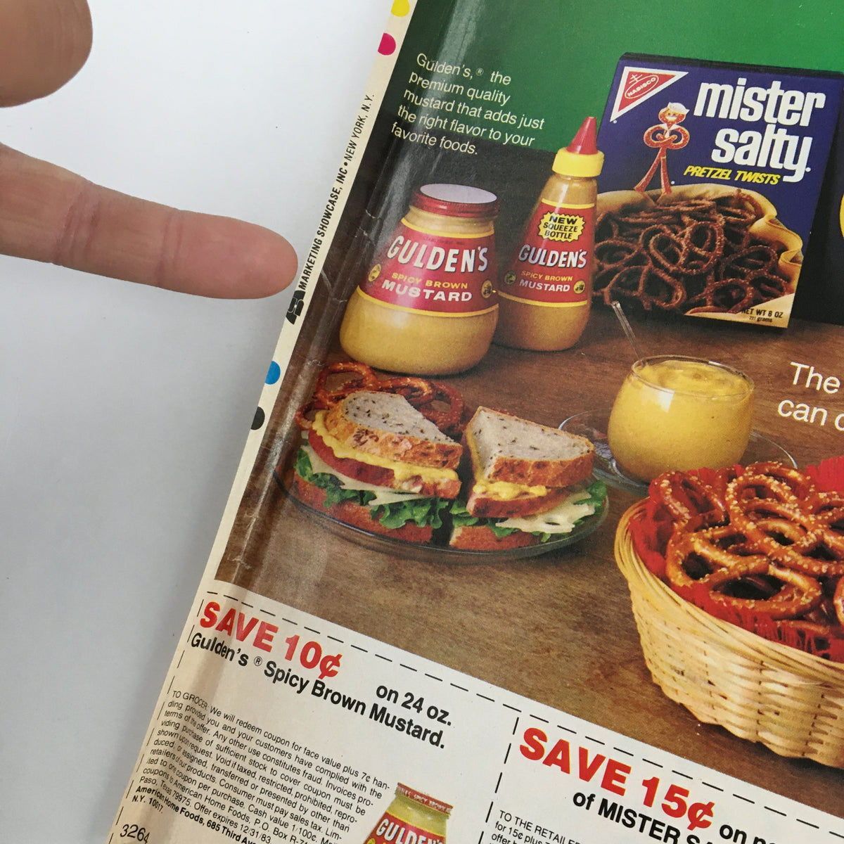 1983 Nabisco America's Leading Brands Circular Coupon Advertisement featuring a display of Gulden's Spicy Brown Mustard with a sandwich, pretzels, and a beverage on the table.