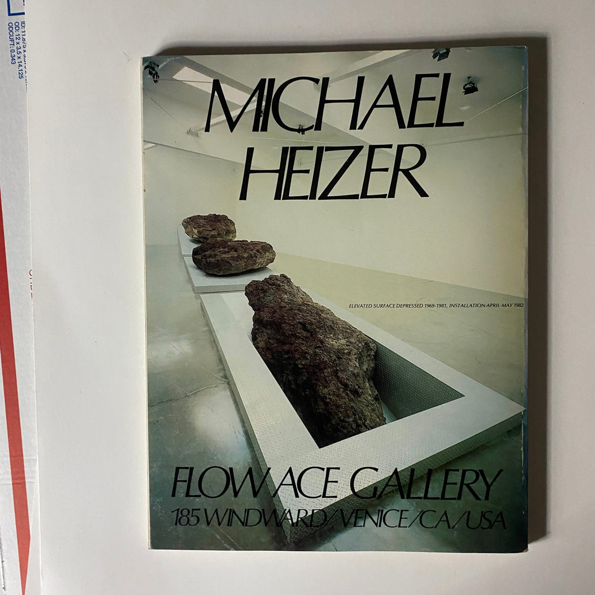 Michael Heizer magazine cover from Flowace Gallery, elevated installation featured in Art in America Magazine, May 1982, capturing modern art and gallery highlights.