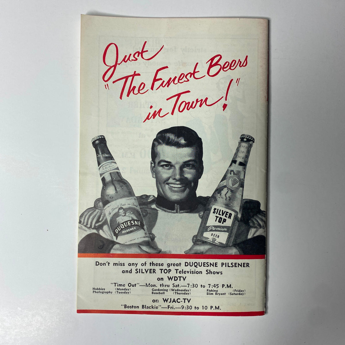 Advertisement page from TV Digest Magazine April 4, 1953 promoting Duquesne Pilsener and Silver Top beer with a smiling male figure holding beer bottles.