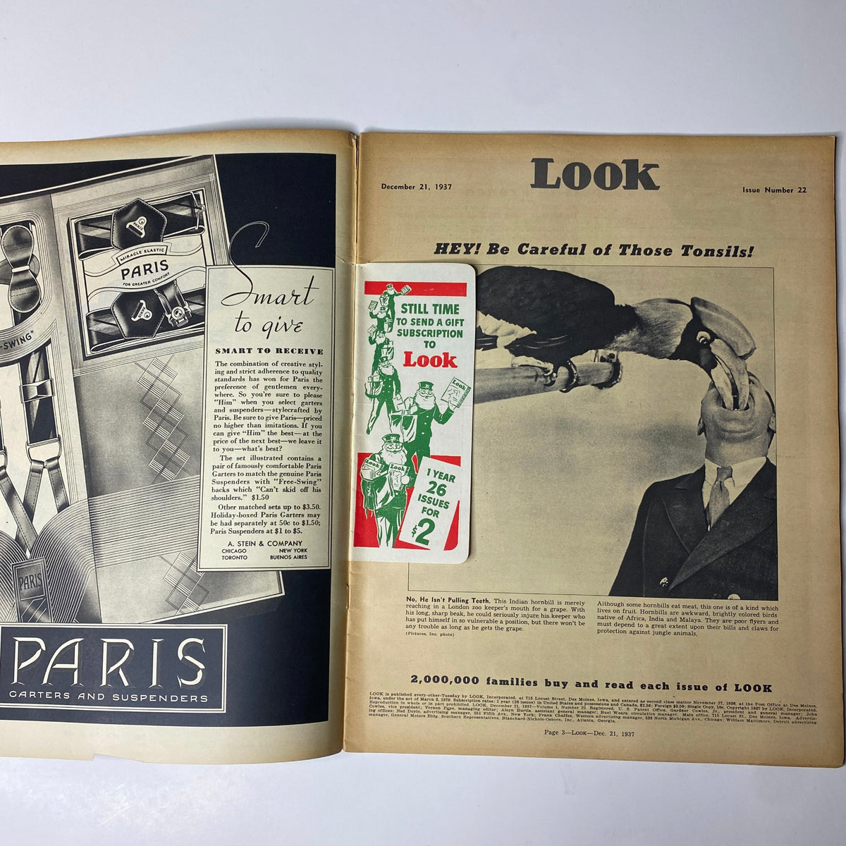 Inside spread of Look Magazine December 21, 1937, featuring advertisements and an editorial cartoon on health awareness.