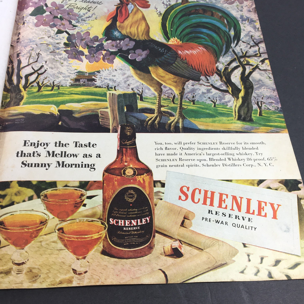 Eye-catching advertisement in Collier's Magazine May 11 1946 for Schenley Reserve whiskey, featuring a picturesque scene with a rooster and cocktail glasses.