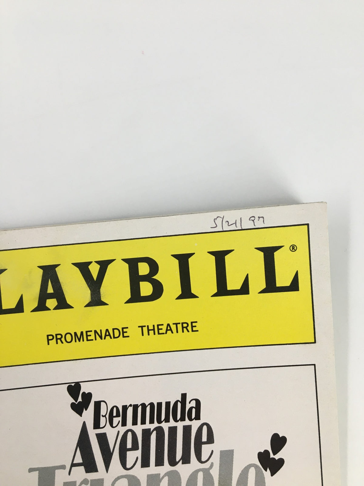 Close-up of the top of the 1997 Playbill from The Promenade Theatre for Bermuda Avenue Triangle, with date notation.