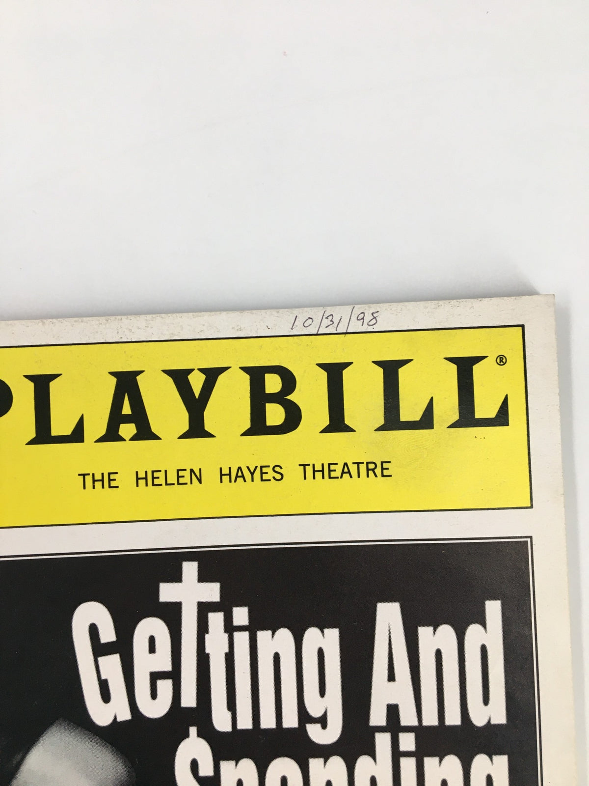 Close-up of the top section of the 1998 Playbill for Getting and Spending, featuring the title and the Helen Hayes Theatre logo.