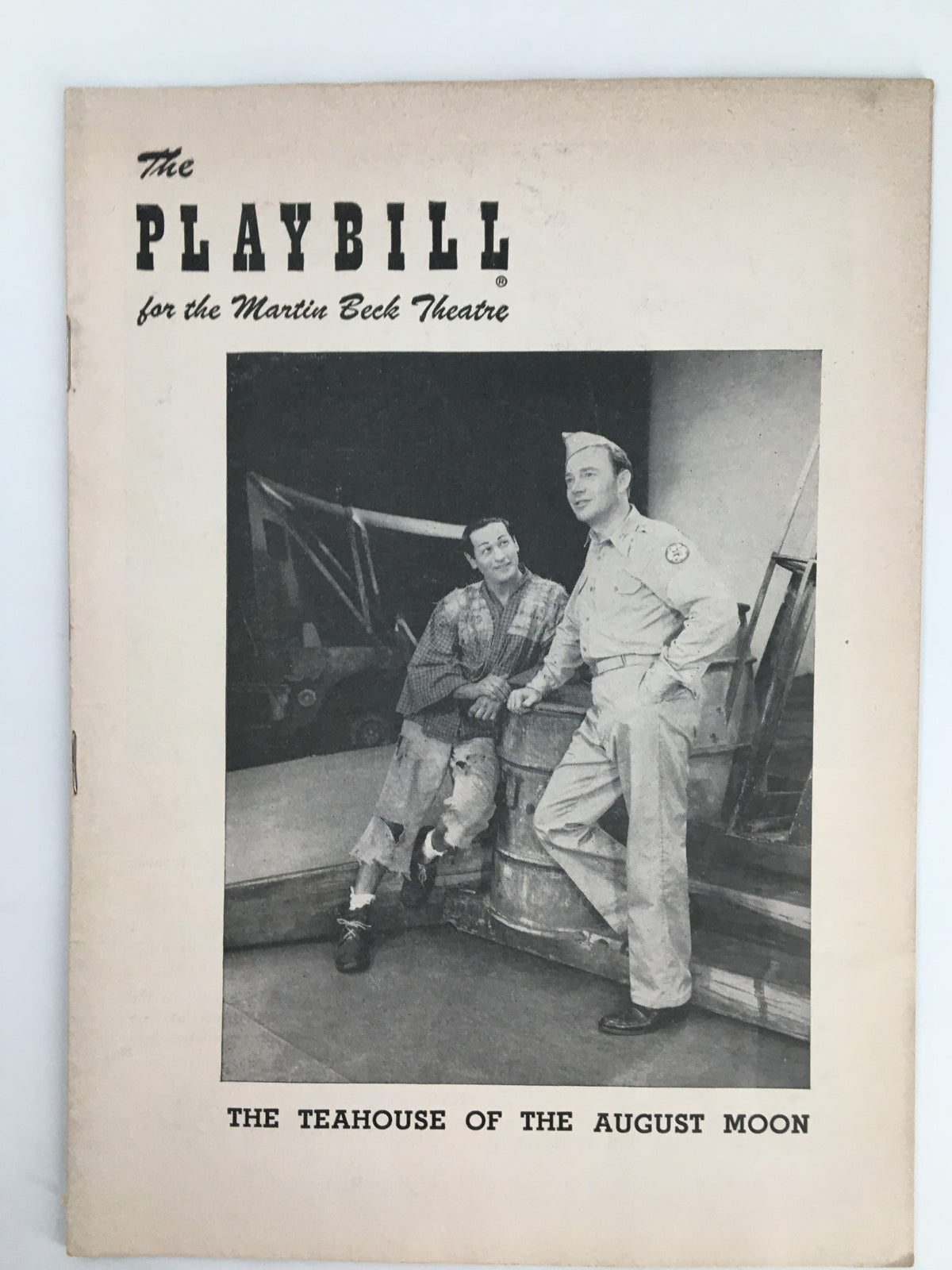 1955 Playbill for the Martin Beck Theatre featuring 'The Teahouse of the August Moon' with a black and white photograph of two characters in costume, showcasing vintage theater memorabilia.