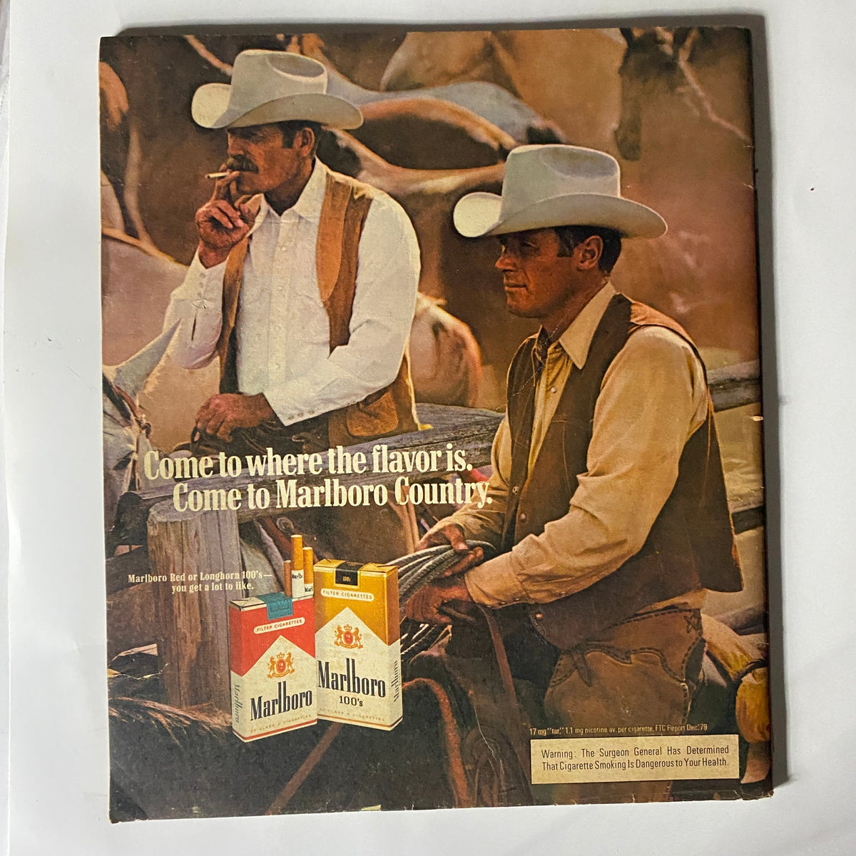 Back cover of Rolling Stone magazine July 9, 1981 issue 347 featuring an advertisement for Marlboro cigarettes, showcasing cowboys in hats with the slogan 'Come to where the flavor is. Come to Marlboro Country.'