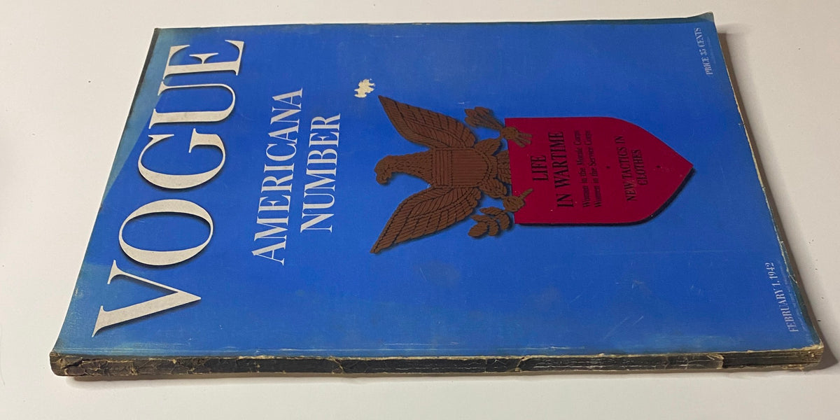 Angled view of Vogue Magazine February 1, 1942, highlighting the 'Americana Number' title and the prominent eagle emblem, reflecting the historical context of women in wartime service.