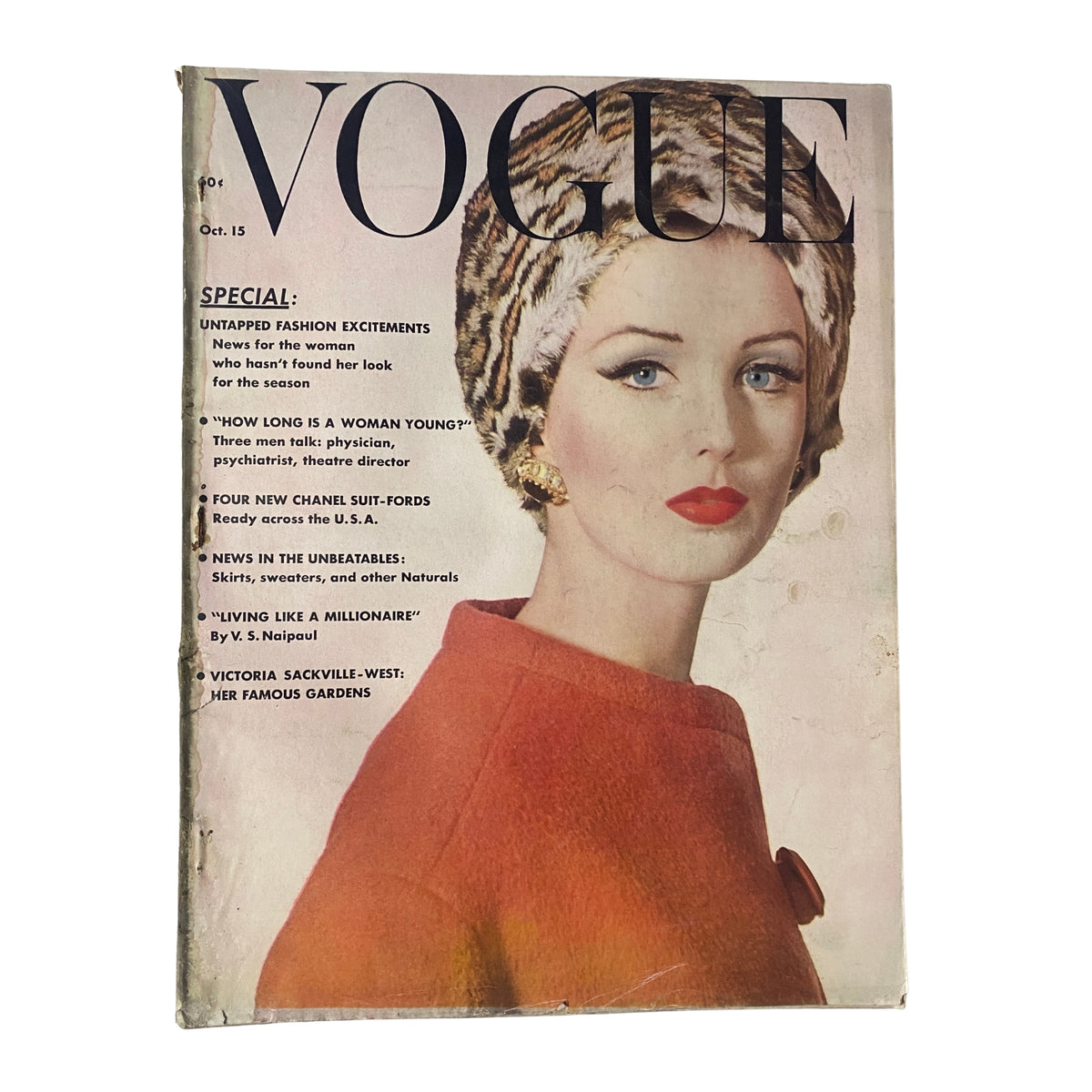 Vogue Magazine October 15, 1961 cover featuring model Dorothy McGowan styled in early 1960s fashion, with unique hairstyle and bold red lipstick, photographed by Irving Penn.