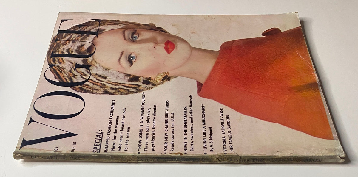 Close-up view of the Vogue Magazine October 15, 1961 cover showcasing model Dorothy McGowan, highlighting her chic look and the magazine's vintage aesthetic.