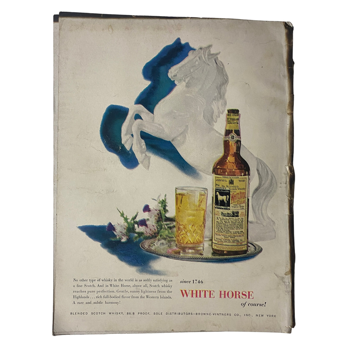 Back cover of Vogue Magazine April 15, 1955 featuring an advertisement for White Horse Scotch Whisky, showcasing a glass of whisky alongside a decorative image, highlighting mid-century advertising aesthetics.