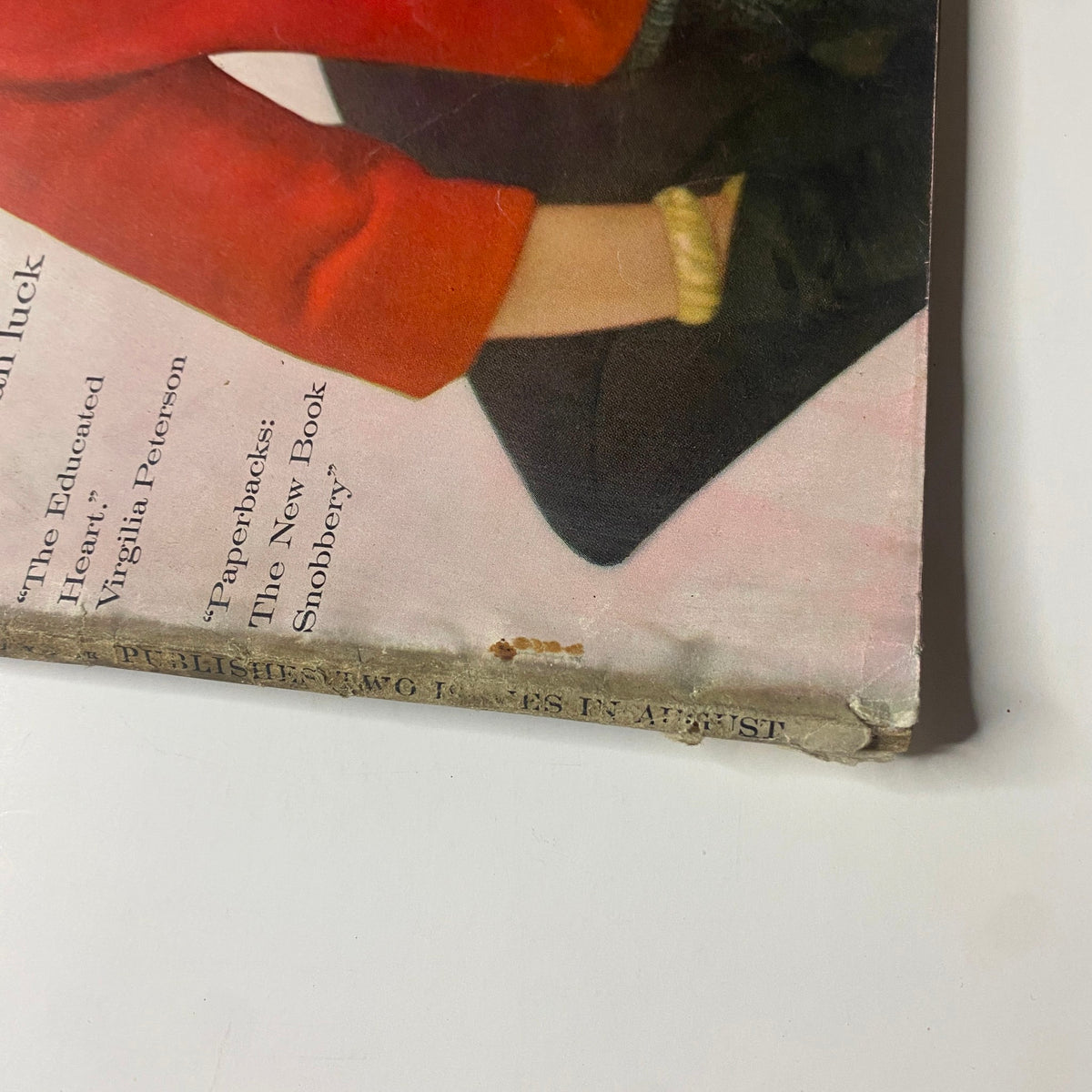Detailed image of the bottom corner of the Vogue Magazine August 15, 1961 cover, highlighting minor wear and aging, indicative of the magazine's vintage nature and authenticity.
