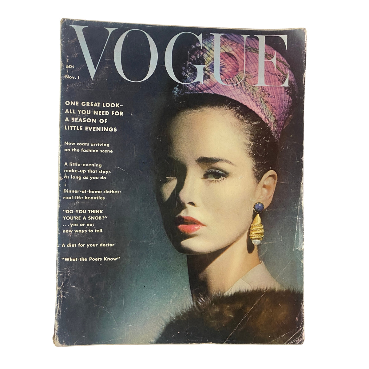 Vogue Magazine November 1, 1961 featuring Sondra Peterson on the cover, styled with elegant accessories against a dark background, exemplifying early 1960s sophistication.