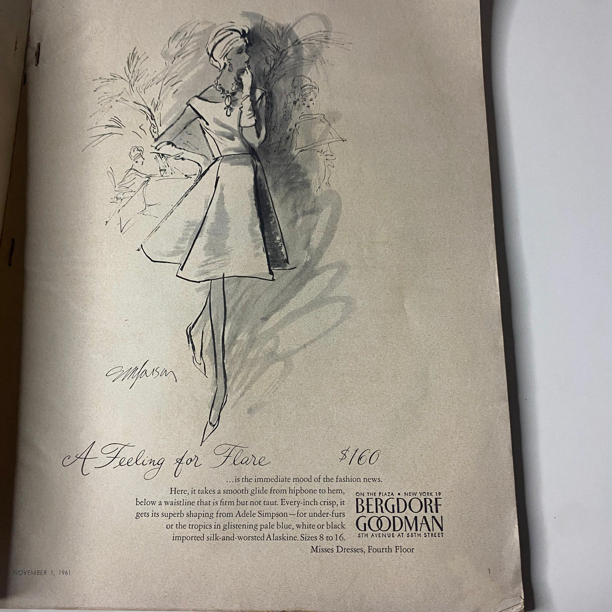 Advertisement for Bergdorf Goodman from Vogue Magazine November 1, 1961 featuring a fashion illustration portraying a woman in a stylish black dress with elegant accessories.