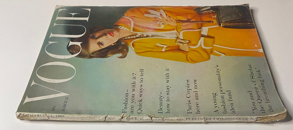 Close-up view of Vogue Magazine March 15, 1960 cover highlighting Lisa Bigelow in a chic orange outfit, enriched with fashion insights and beauty tips from the era.