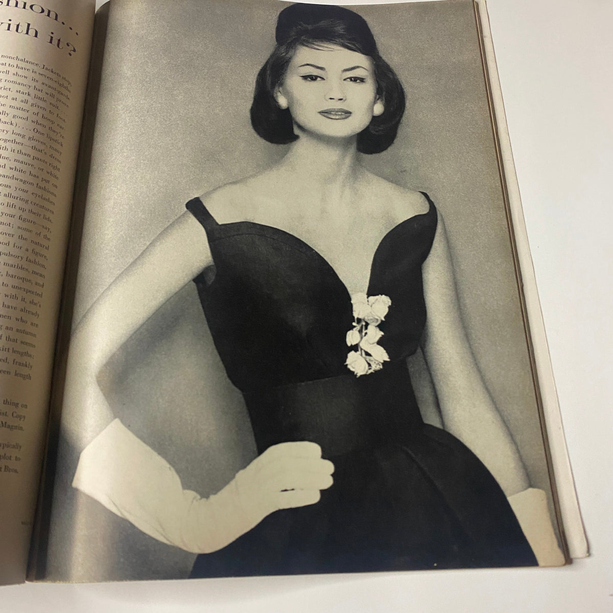 A striking black and white photograph of model Lisa Bigelow wearing a stylish dress, featured in Vogue Magazine March 15, 1960, captured by iconic photographer Horst P. Horst.