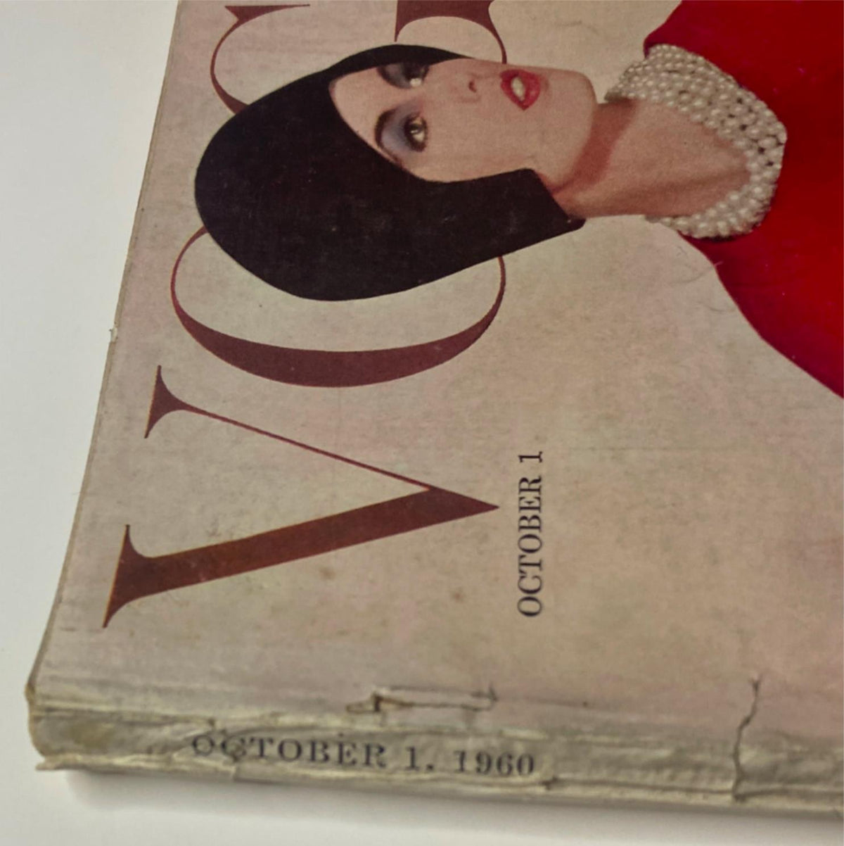 Detail of the cover of Vogue Magazine October 1, 1960 featuring Dorothy McGowan, highlighting the magazine's vintage design and publication date.