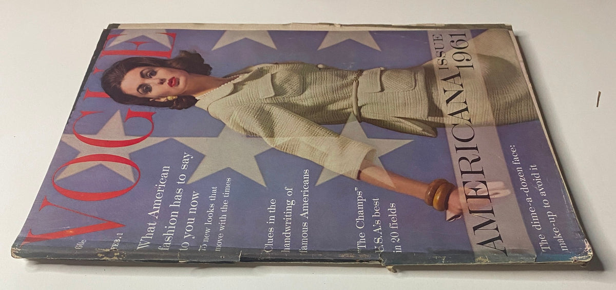 Cover of Vogue Magazine February 1, 1961 featuring model Dorothy McGowan photographed by Herbert Matter, showcasing a vintage fashion style with a patriotic star motif in the background.