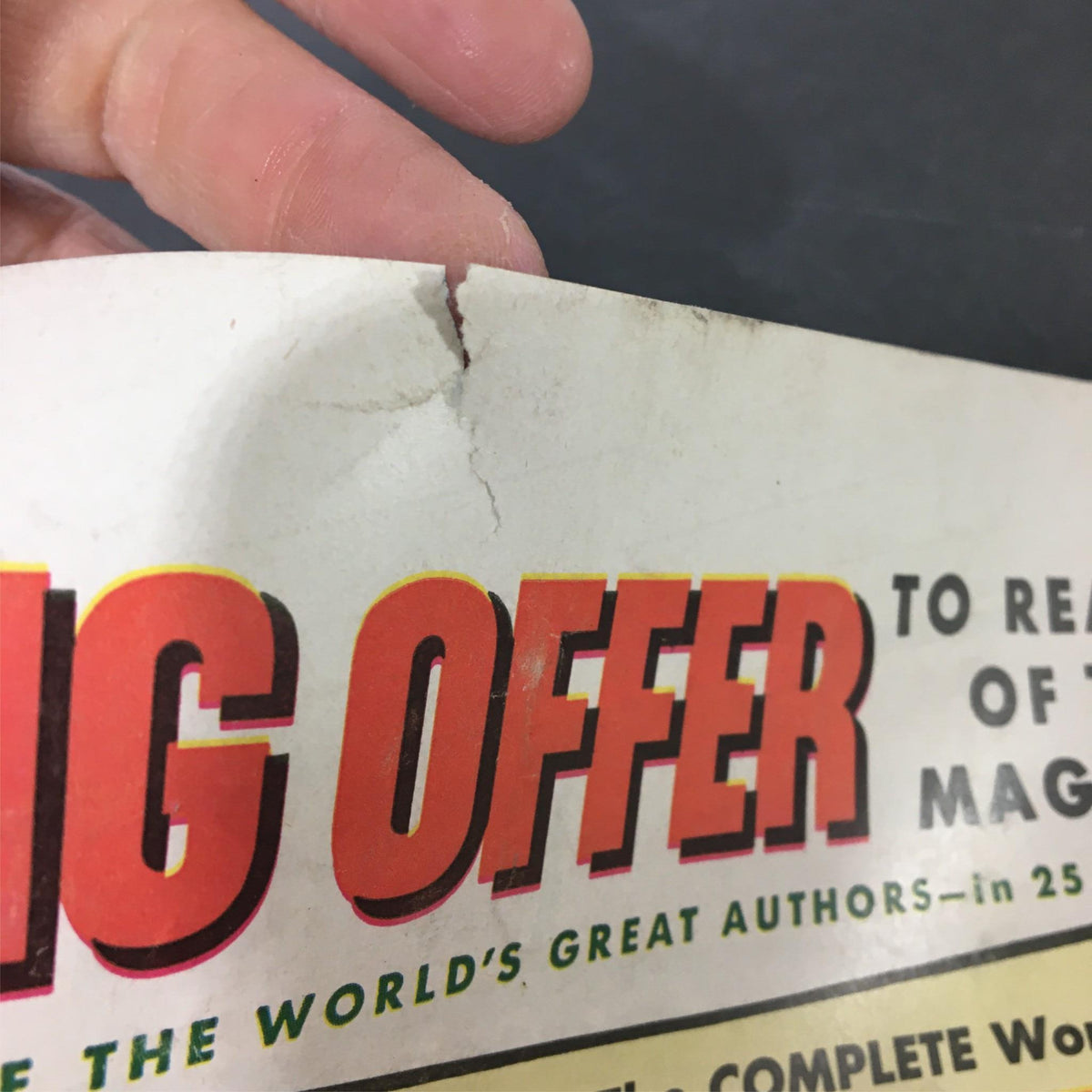 Close-up of the corner of a 1952 Collier's magazine, depicting a tear and promoting a special offer, highlighting the magazine's vintage appeal and connection to American history.