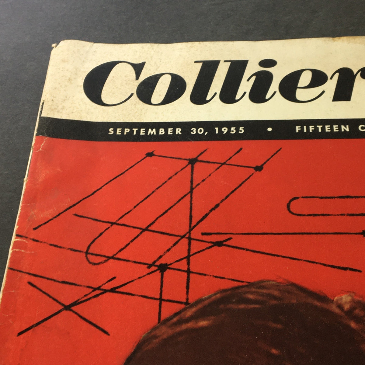 Close-up of the top section of VTG Collier's Magazine dated September 30, 1955, highlighting the title and date, along with artistic lines and details on the vintage cover.