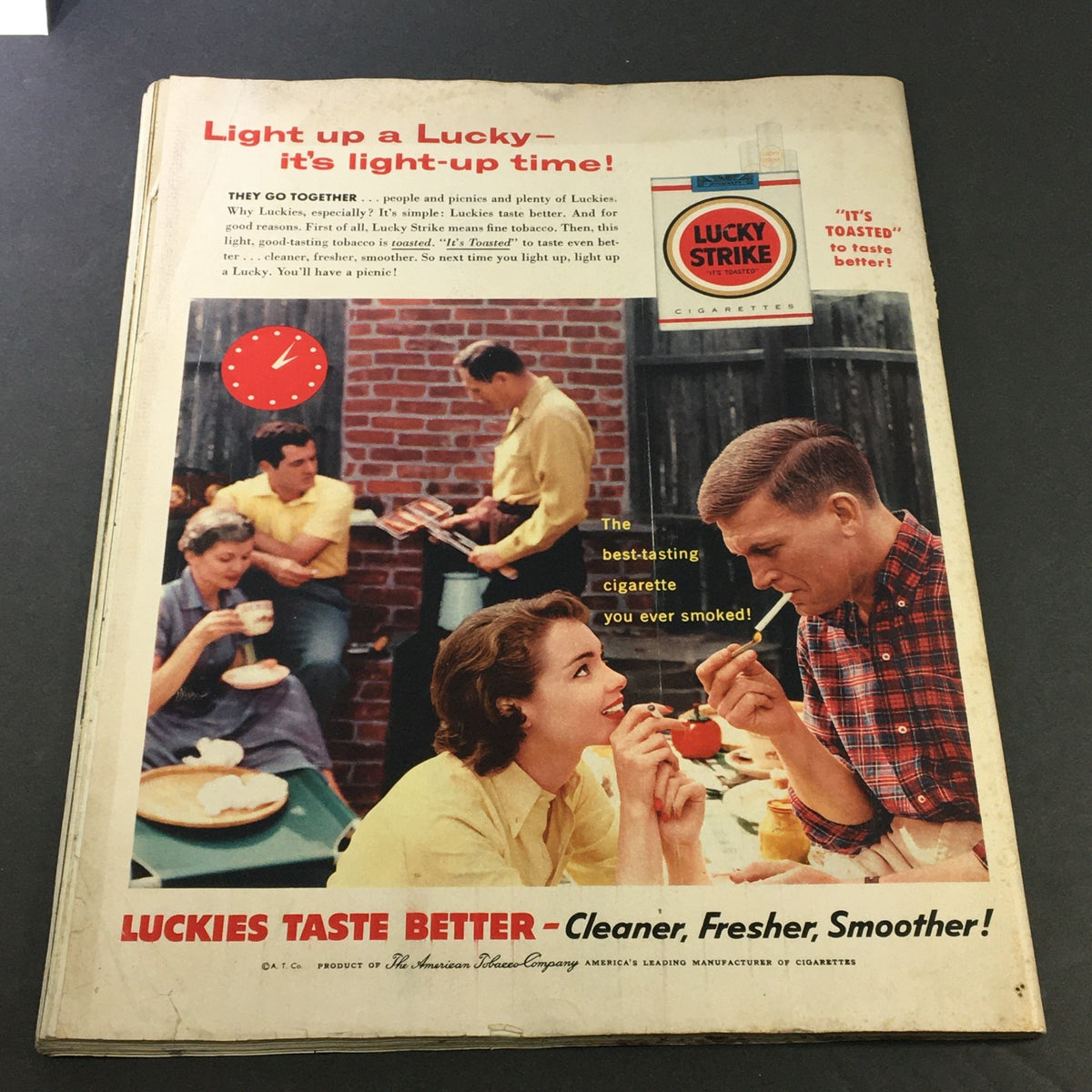 Retro advertisement for Lucky Strike cigarettes in a social picnic setting, emphasizing the experience and taste in Collier's Magazine, September 30, 1955.