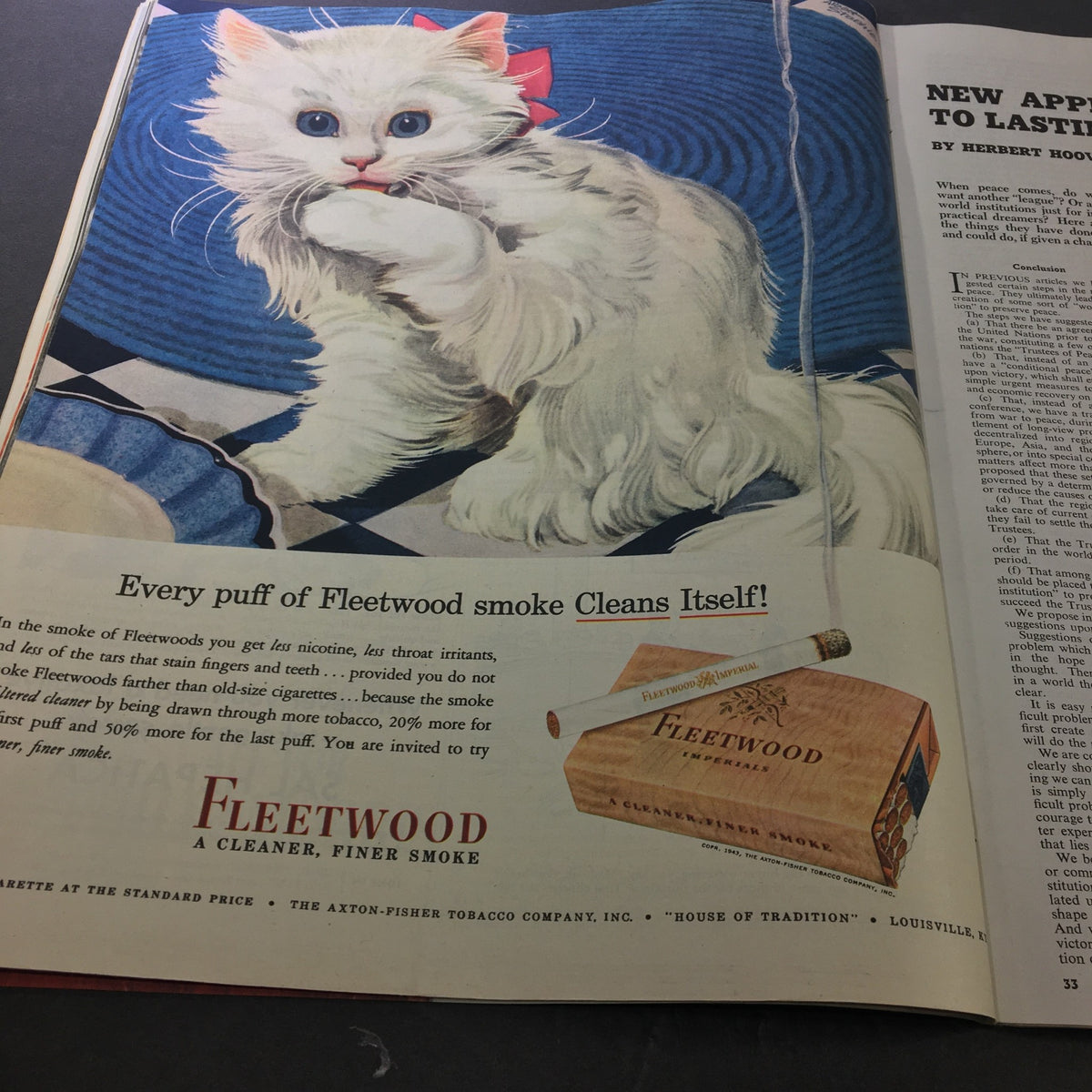 Collier's Magazine June 26, 1943 presents an advertisement for Fleetwood cigarettes, featuring a playful white cat with a bow, promoting a cleaner smoking experience.