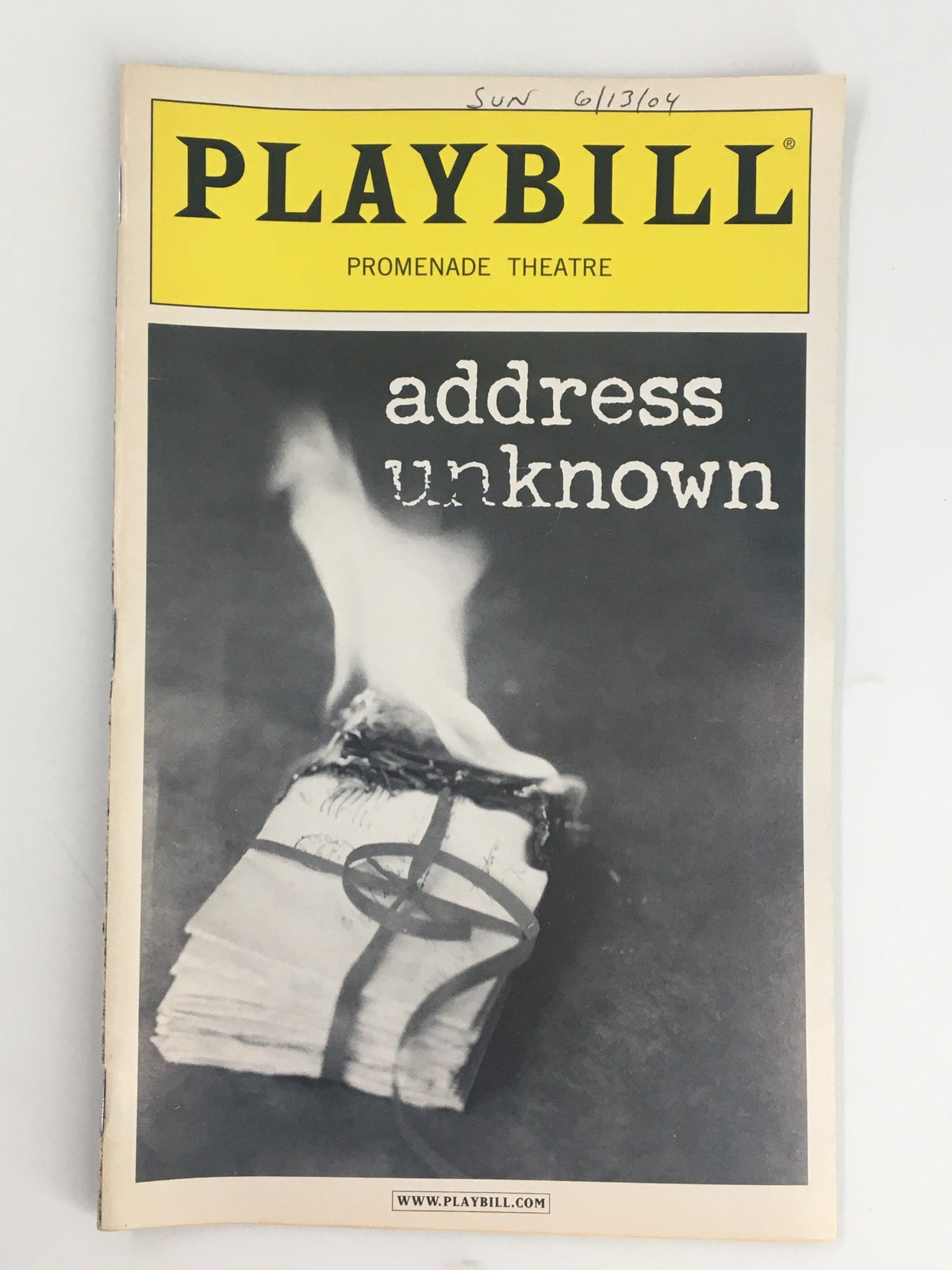 2004 Playbill for Address Unknown at The Promenade Theatre featuring a striking cover image of a burning book, showcasing the performances of Jim Dale and William Atherton.