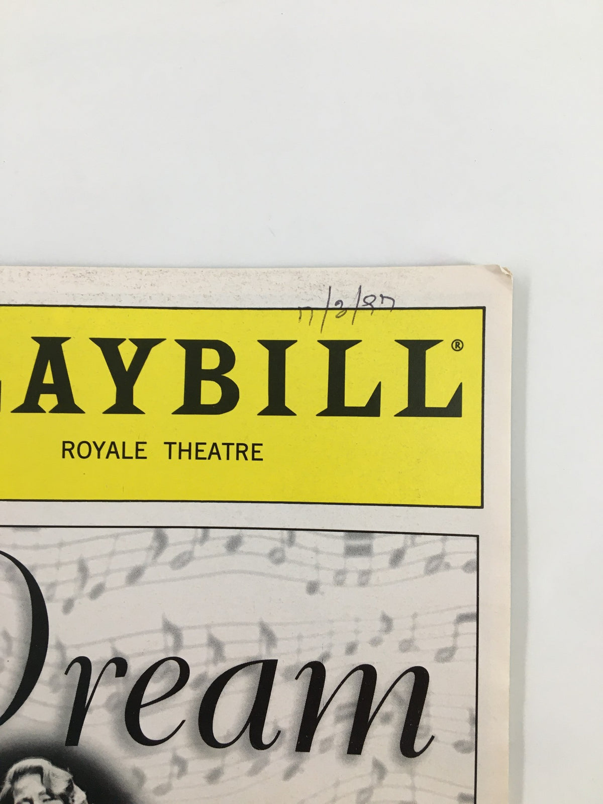 Close-up of the top section of the 1997 Playbill for 'Dream' at Royale Theatre, highlighting the program title and the date notation.