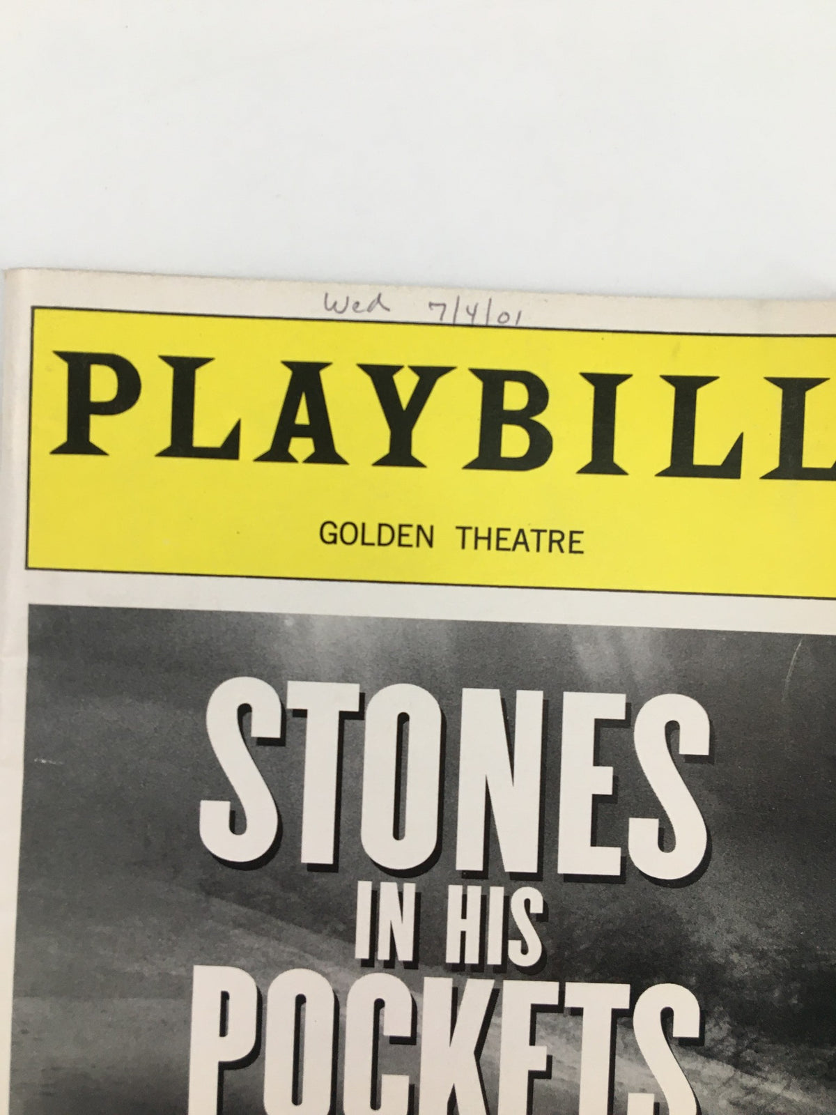 Close-up of the 2001 Playbill for 'Stones in His Pockets' at the Golden Theatre, highlighting the title and date.