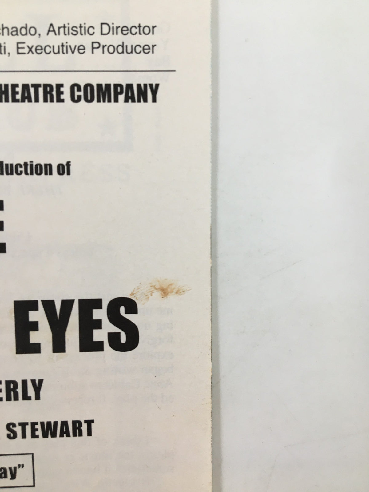Close-up image of the 2001 Playbill for Saint Lucy's Eyes, showing a mark on the edge, emphasizing its vintage character.