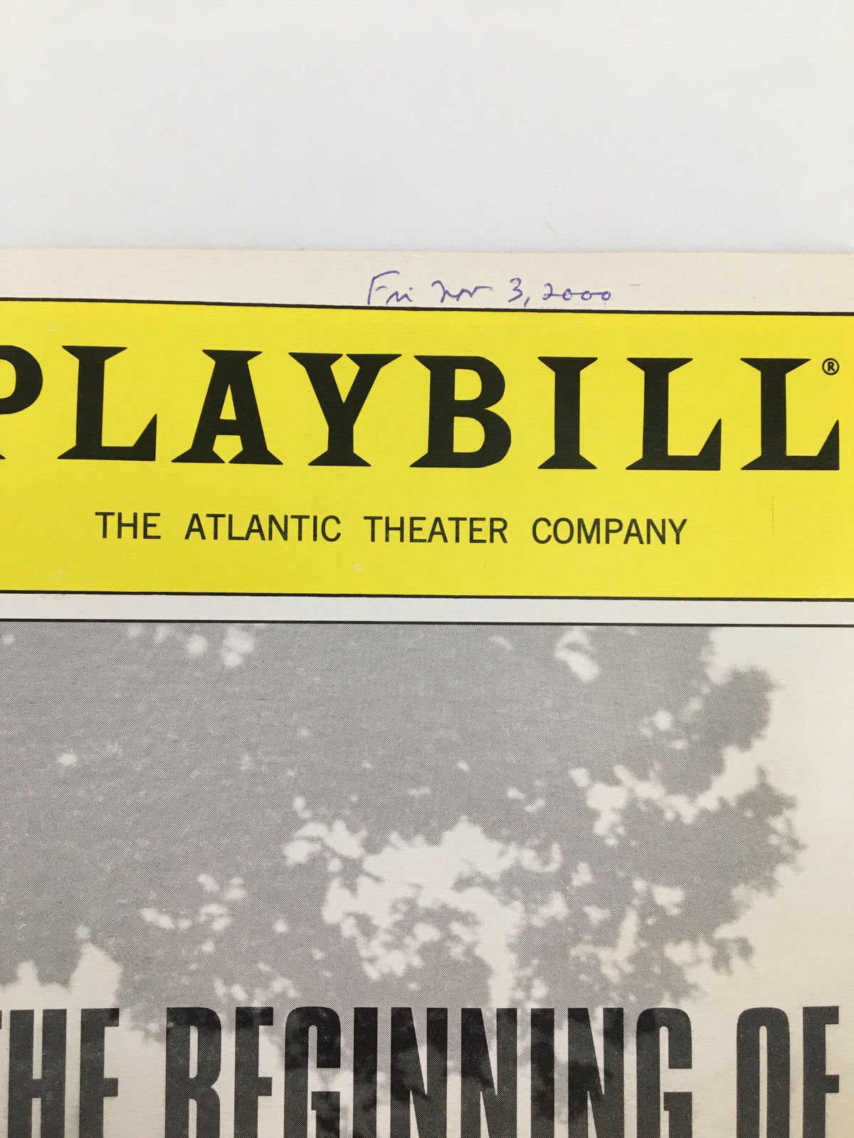 Close-up of the 2000 Playbill from the Atlantic Theater Company featuring Garret Dillahunt in 'The Beginning of August', showcasing the theater's logo and handwritten date of November 3, 2000.