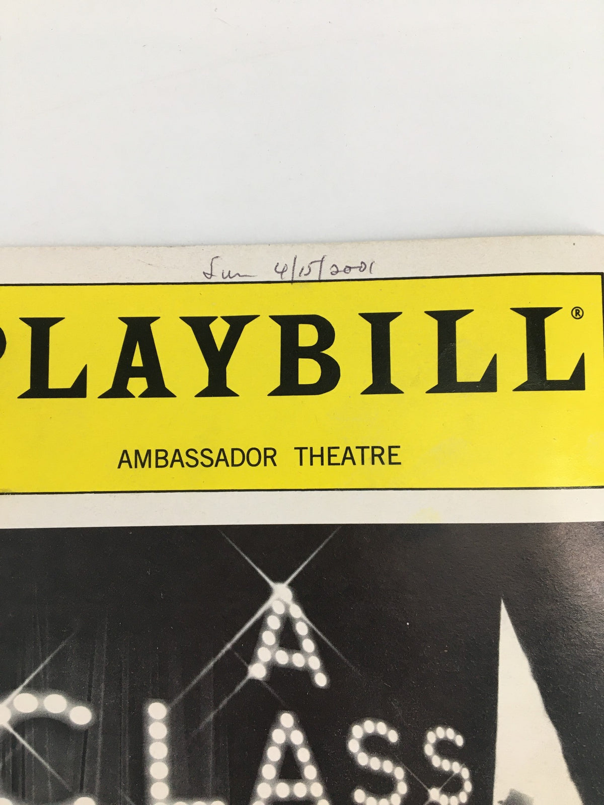 Close-up of the 2001 Playbill for 'A Class Act' showing the header with 'AMBASSADOR THEATRE' and a handwritten date.