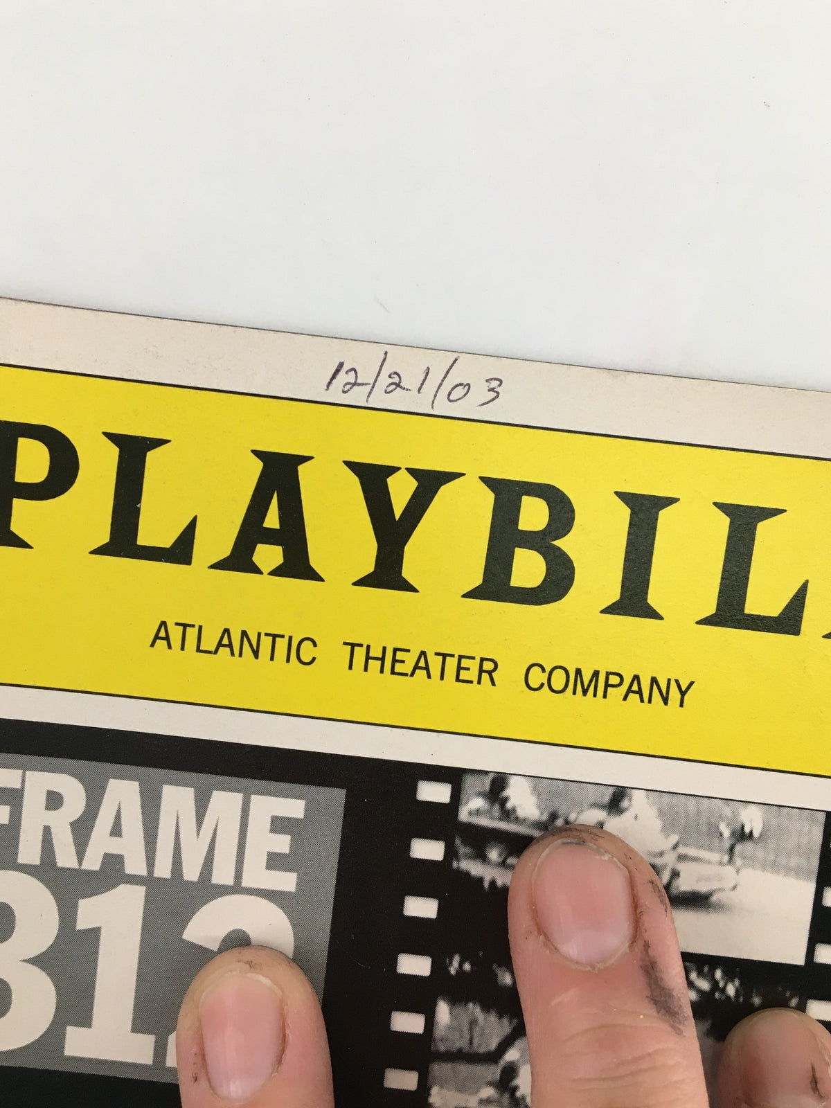 Close-up of the 2003 Atlantic Theater Company Playbill with handwritten date 12/21/03.