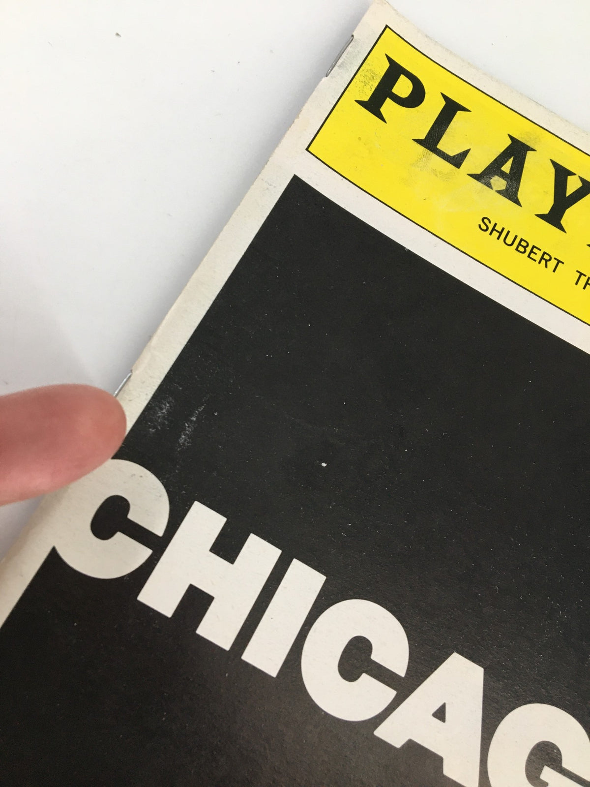 1999 Playbill from Sam S. Shubert Theatre featuring the title 'Chicago' with signs of wear on the cover.