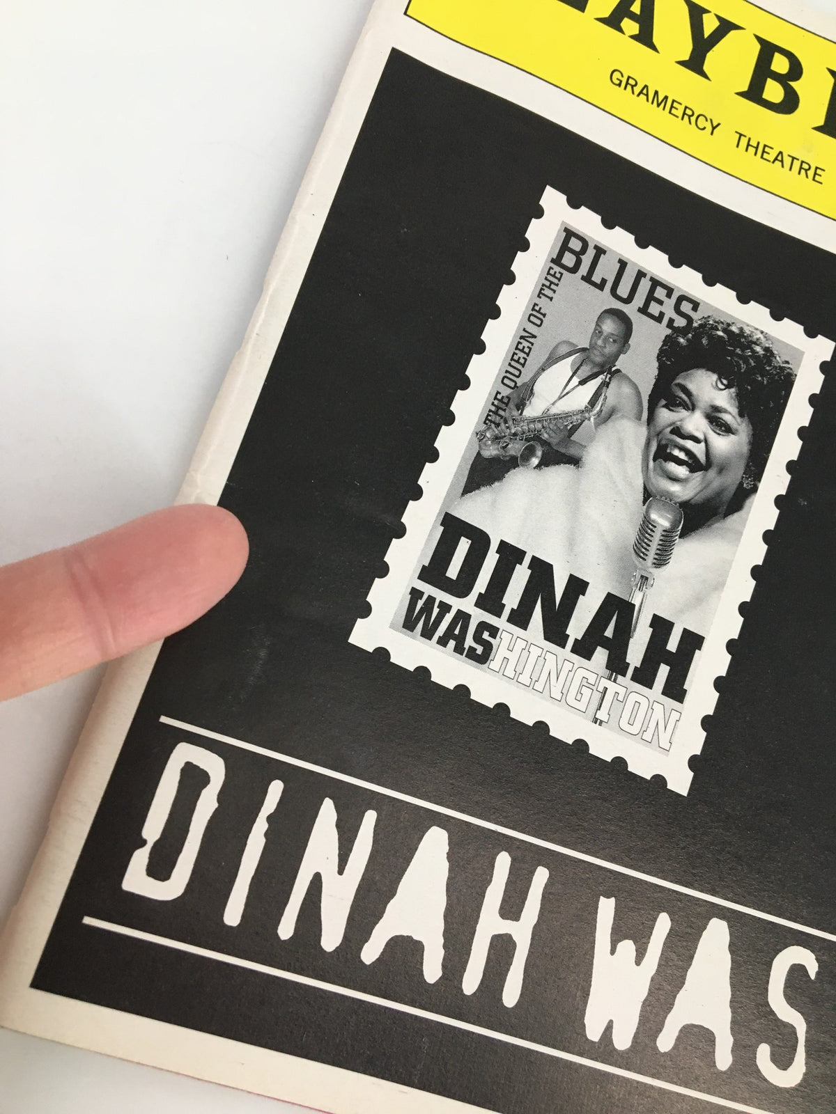 1998 Playbill for Dinah Was: The Dinah Washington Musical, featuring a black and white image of Dinah Washington, emphasizing her title as the "Queen of the Blues."