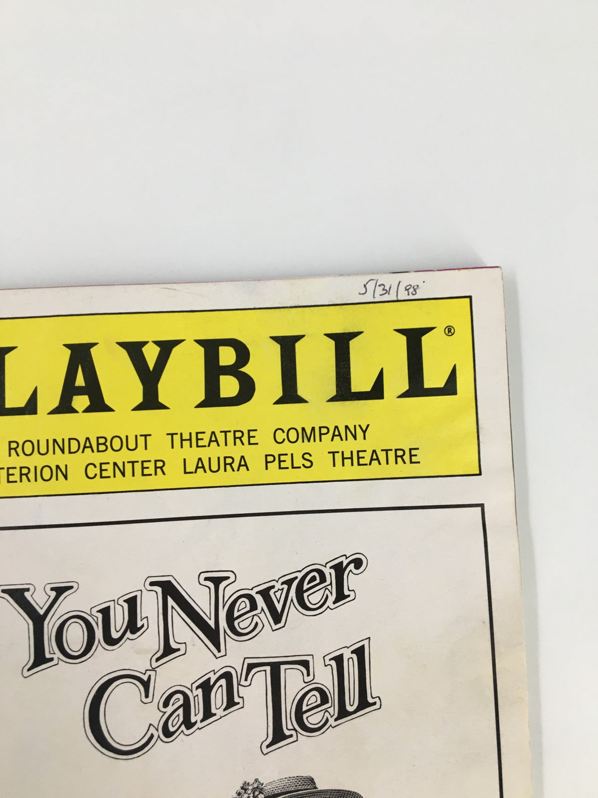 Close-up of the 1998 Playbill Criterion Center Laura Pels Theatre, showing the title 'You Never Can Tell' with date inscription.