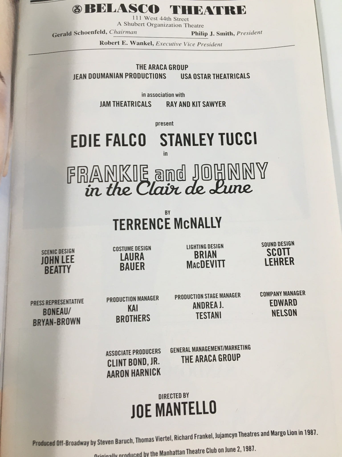 2002 Playbill from the Belasco Theatre featuring the production of 'Frankie and Johnny in the Clair de Lune', showcasing cast names including Edie Falco and Stanley Tucci, with artistic design elements reflecting the theatrical theme.